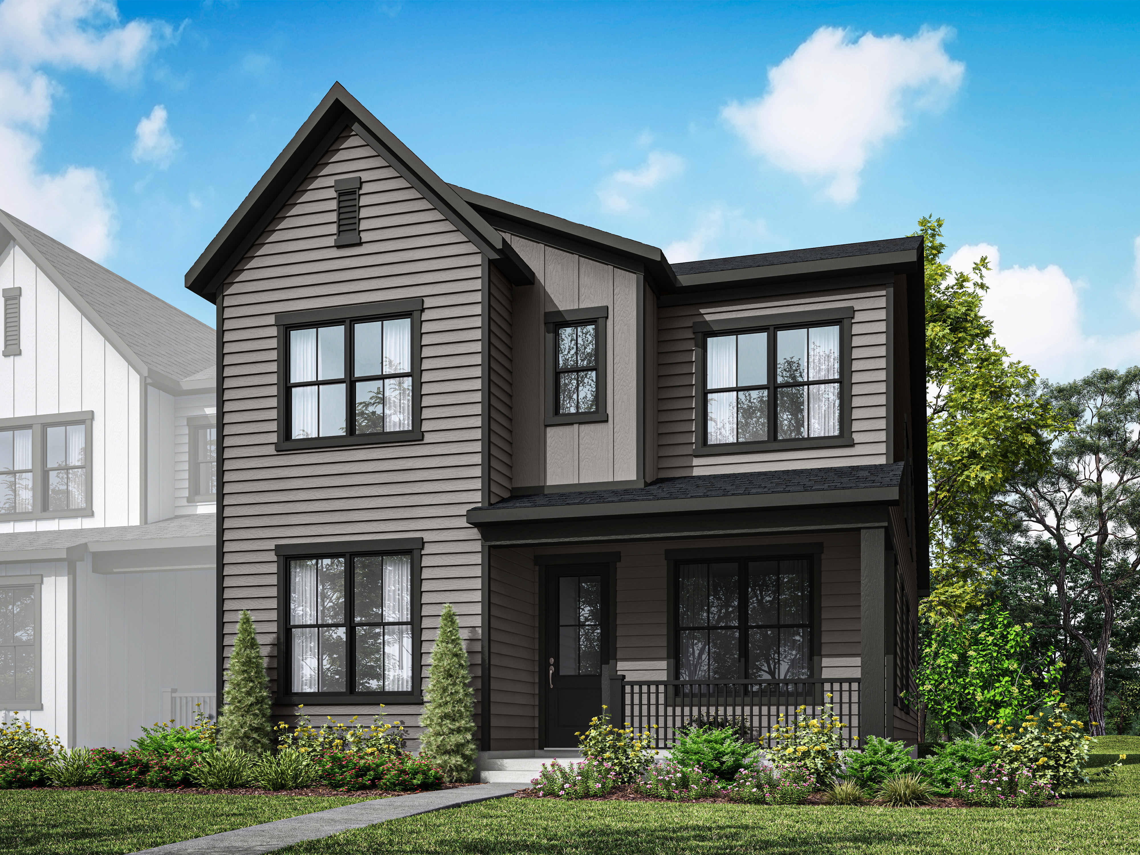 A two-story modern farmhouse with a black exterior, surrounded by lush greenery and a clear blue sky with fluffy white clouds.
