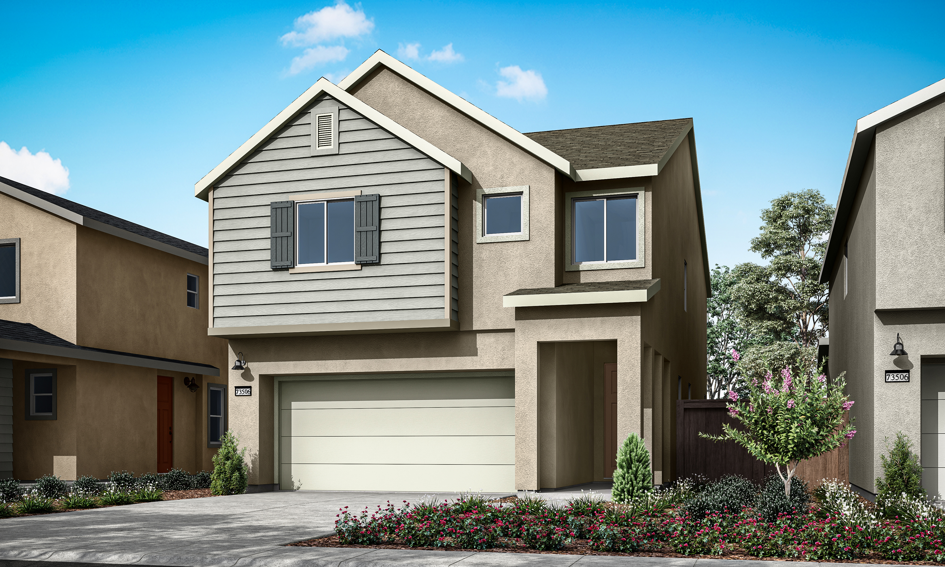 A two-story residential house with a garage, surrounded by landscaped gardens and a clear blue sky in the background.