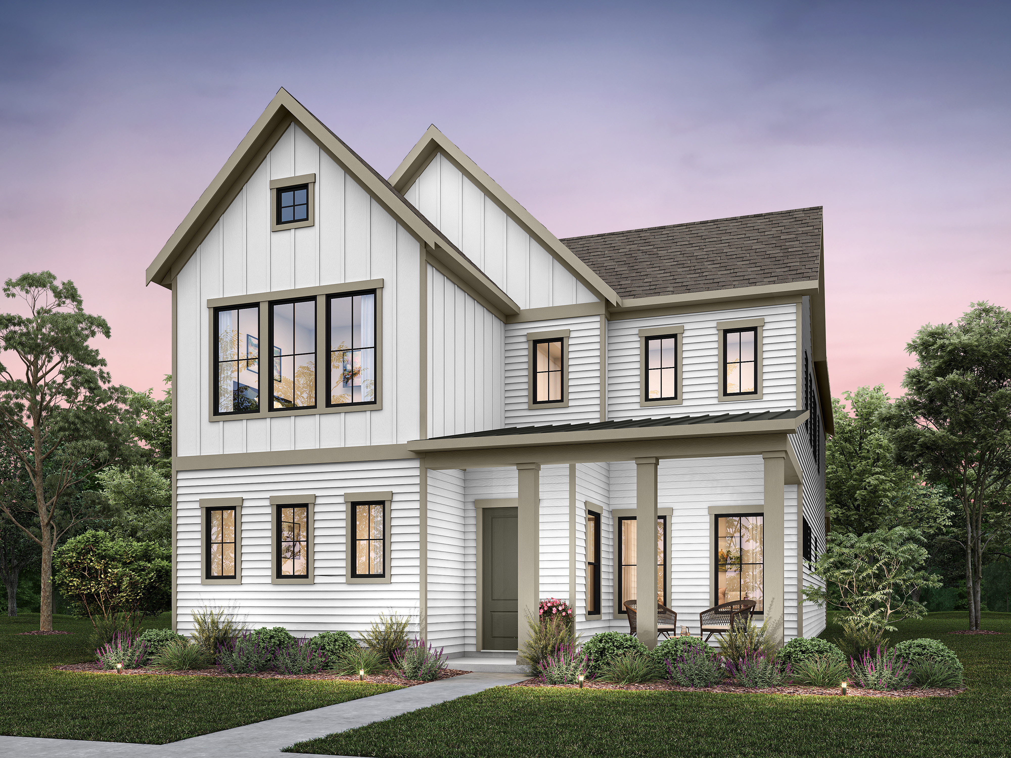 A modern white farmhouse with a covered porch and seating sits amidst lush greenery and trees under a twilight sky.