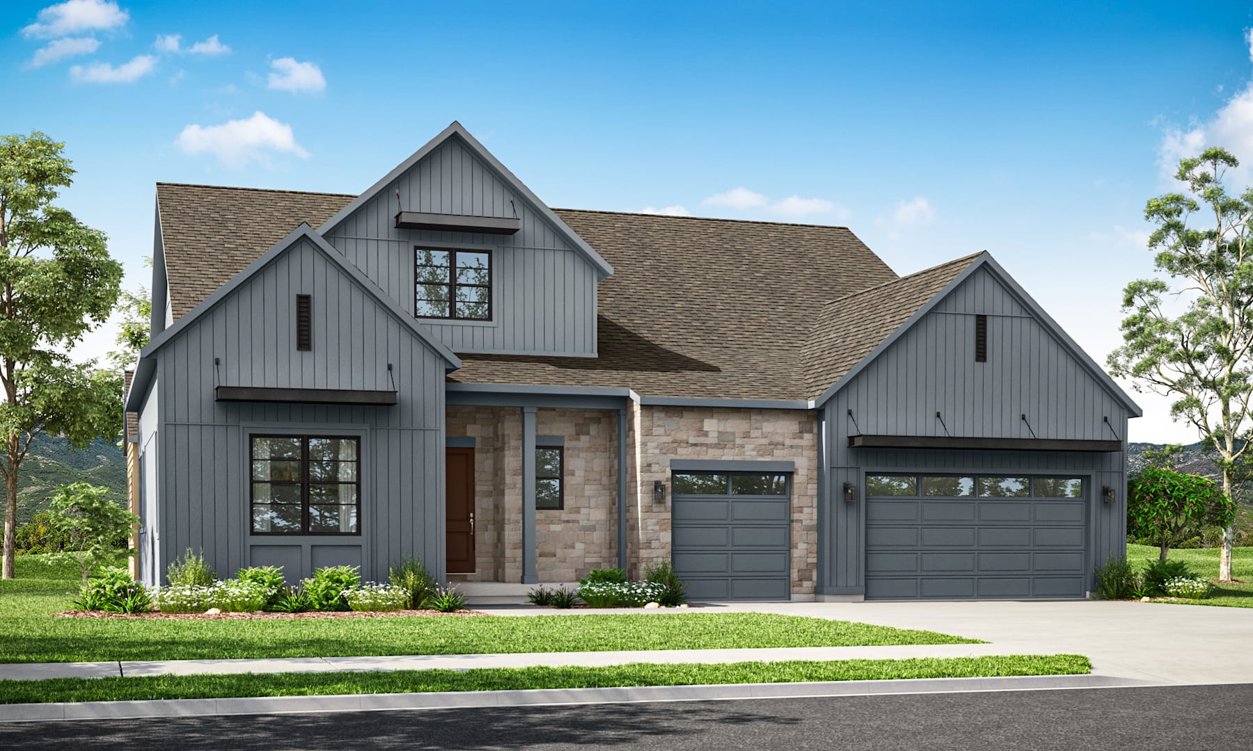 A two-story gray house with a gabled roof, stone accents, and a three-car garage stands in a well-landscaped yard with trees and greenery in the background.