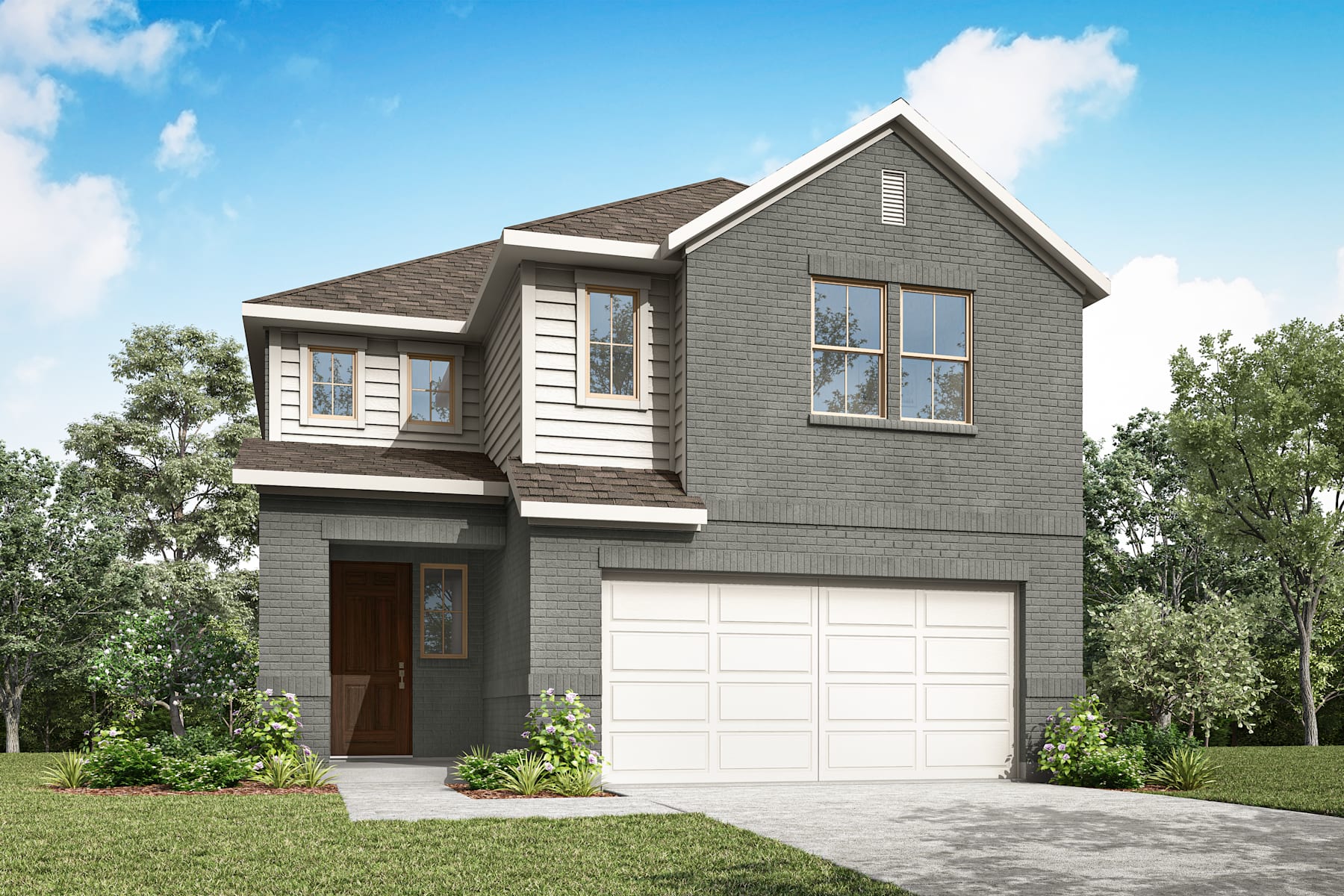 A two-story gray house with a garage stands in a grassy area surrounded by trees against a blue sky with white clouds.