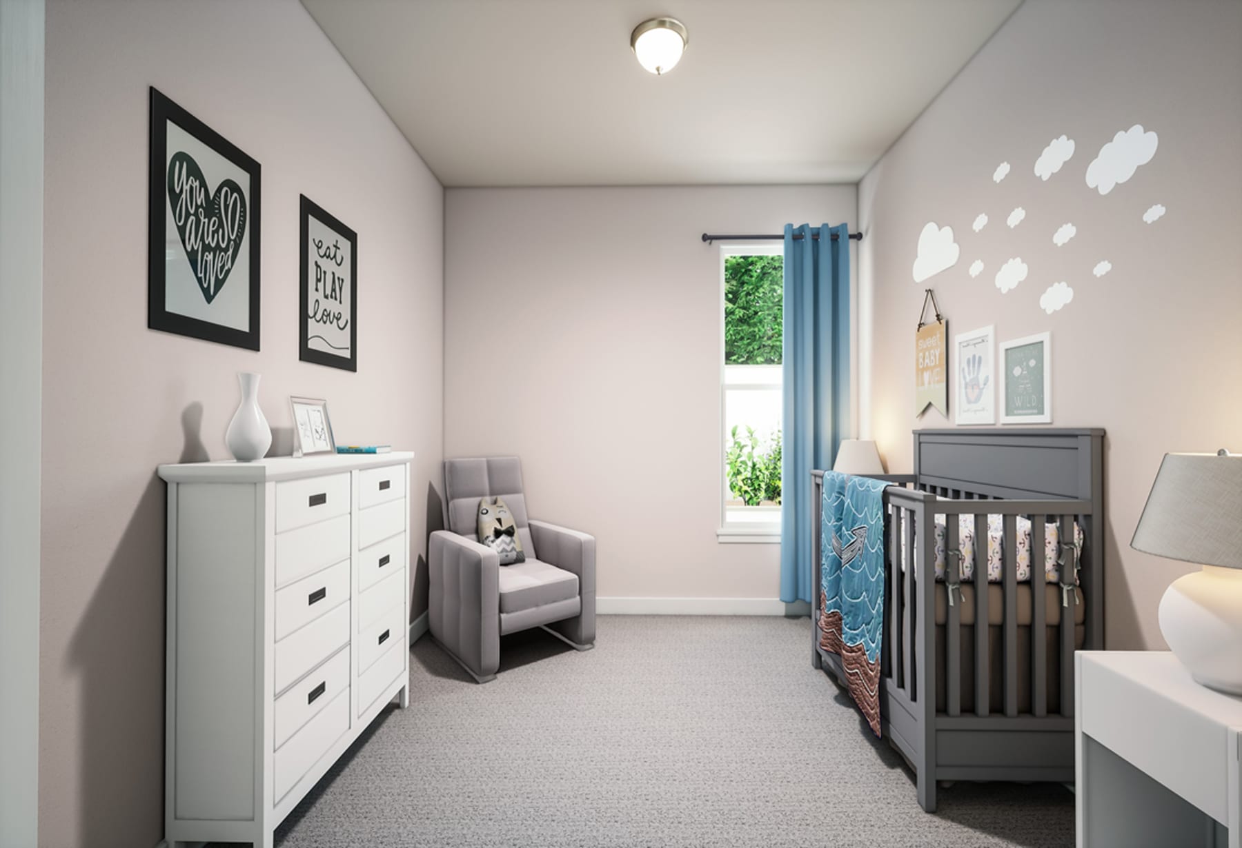 A cozy and well-designed nursery with a white dresser, a gray crib, and framed artwork on the walls, set against a neutral color scheme and a view of the outdoors through a window.