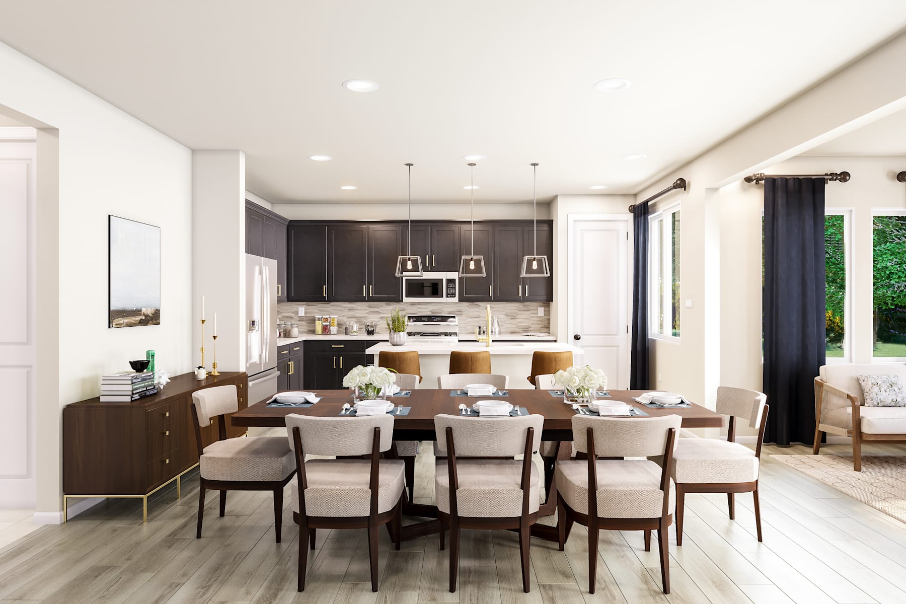 A modern and spacious open-concept kitchen and dining area with dark wood cabinetry, a large dining table with white chairs, and a cozy living space visible in the background.