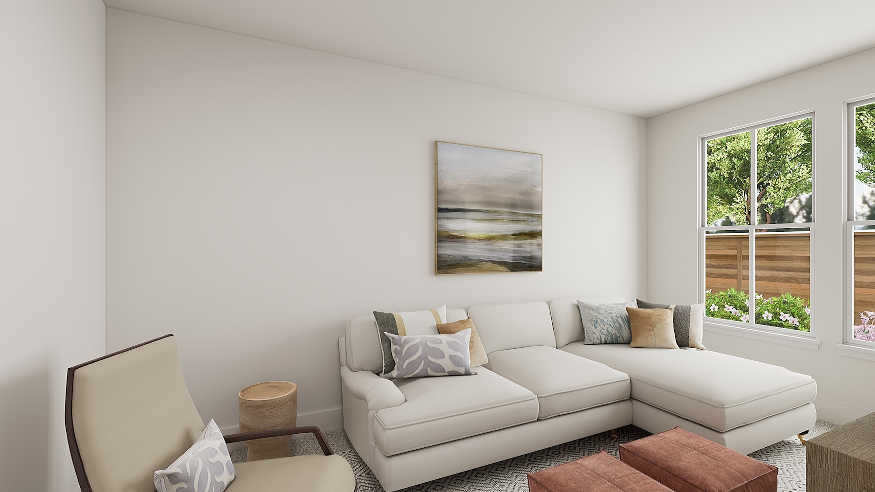 A cozy and inviting living room with a comfortable sectional sofa, a framed artwork on the wall, and a large window overlooking a lush outdoor scene.