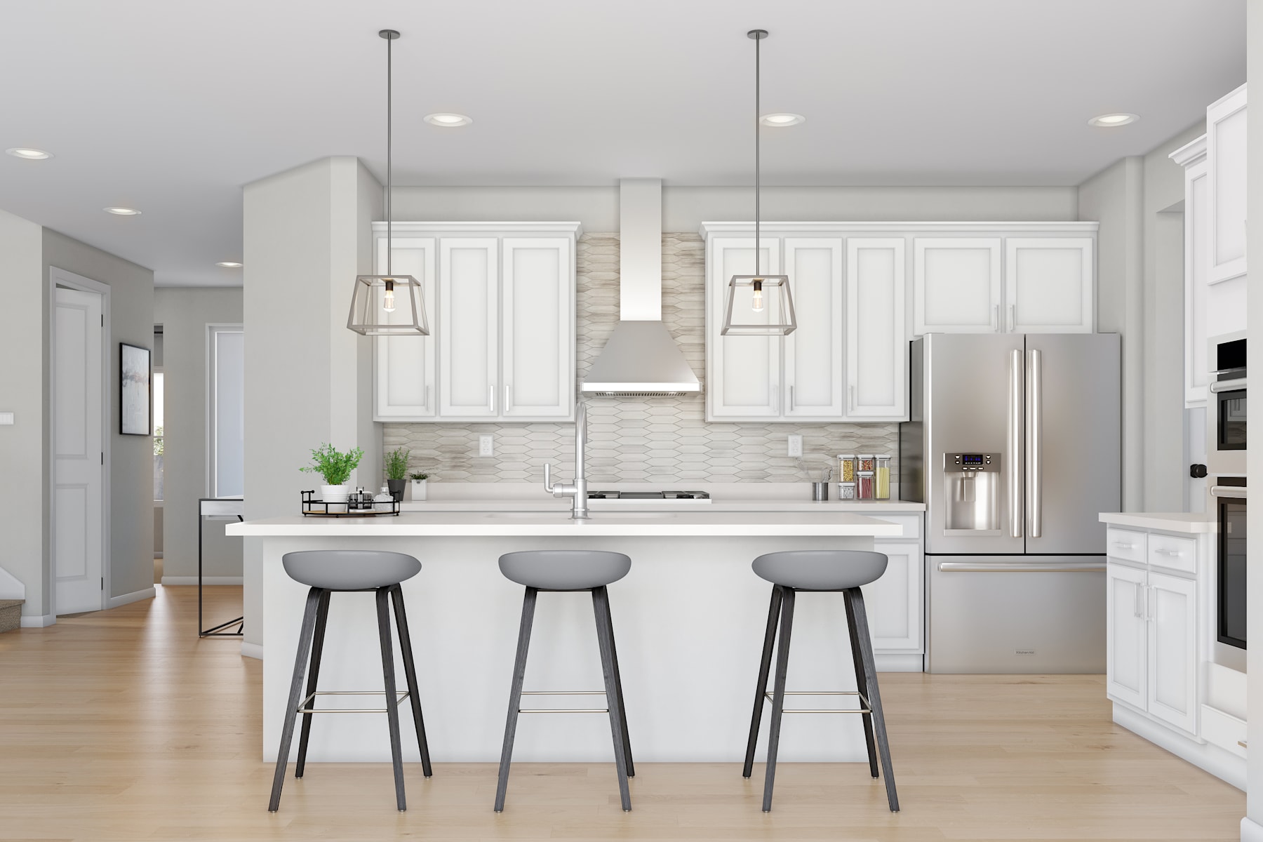 A modern, open-concept kitchen with white cabinets, a central island with bar stools, and pendant lighting fixtures.