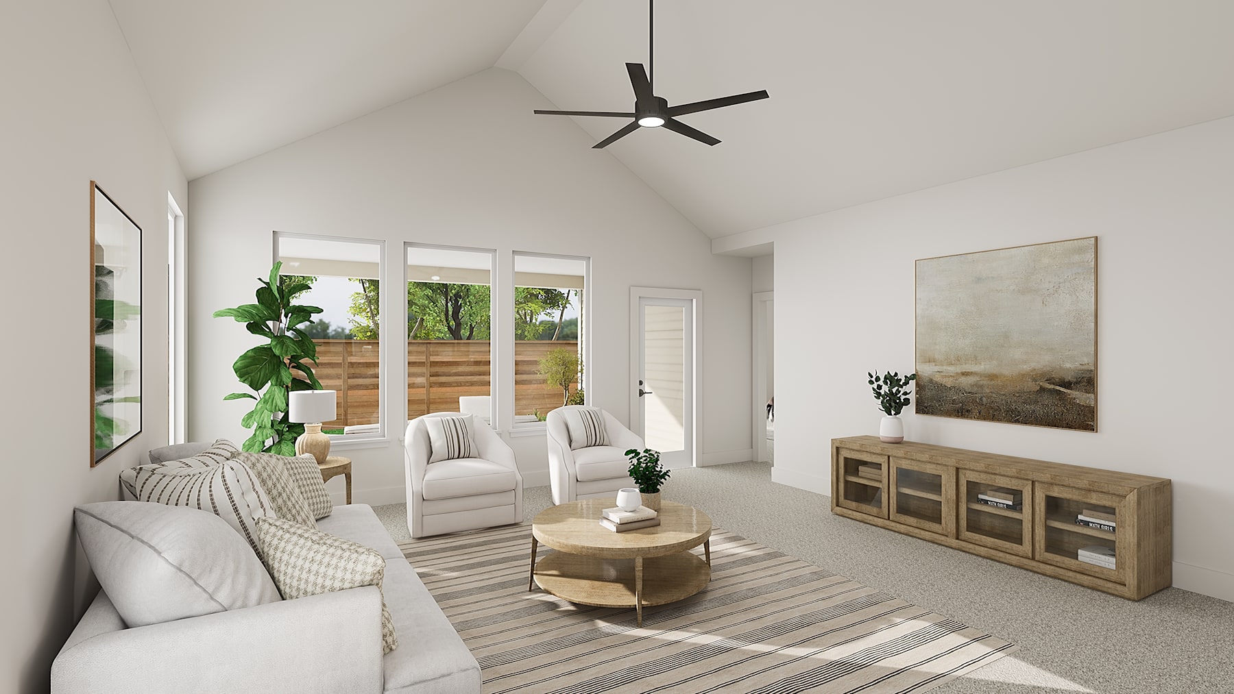 A bright and airy living room with a vaulted ceiling, featuring a modern ceiling fan, plush white furniture, and a wooden cabinet against the wall, surrounded by large windows overlooking a lush outdoor scene.