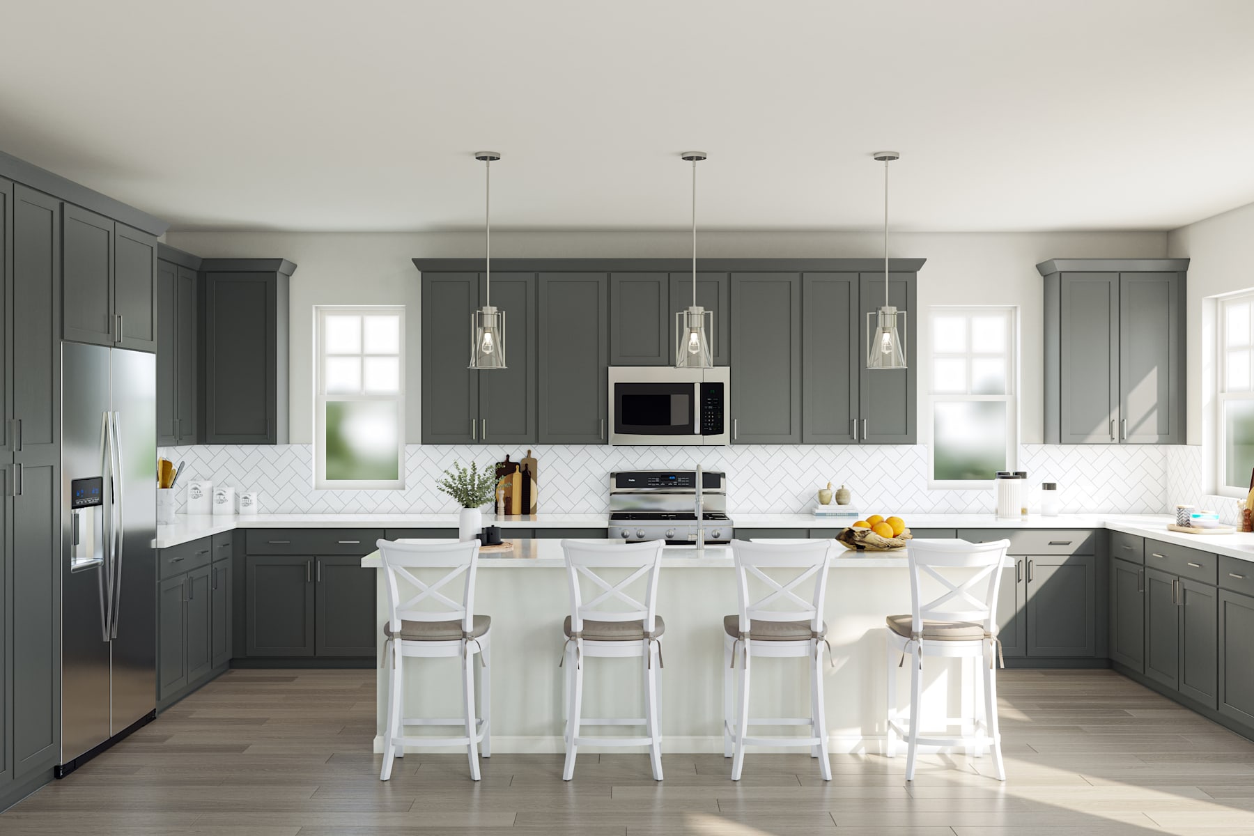 A modern, well-designed kitchen with gray cabinets, white countertops, and pendant lighting over a central island with stools.