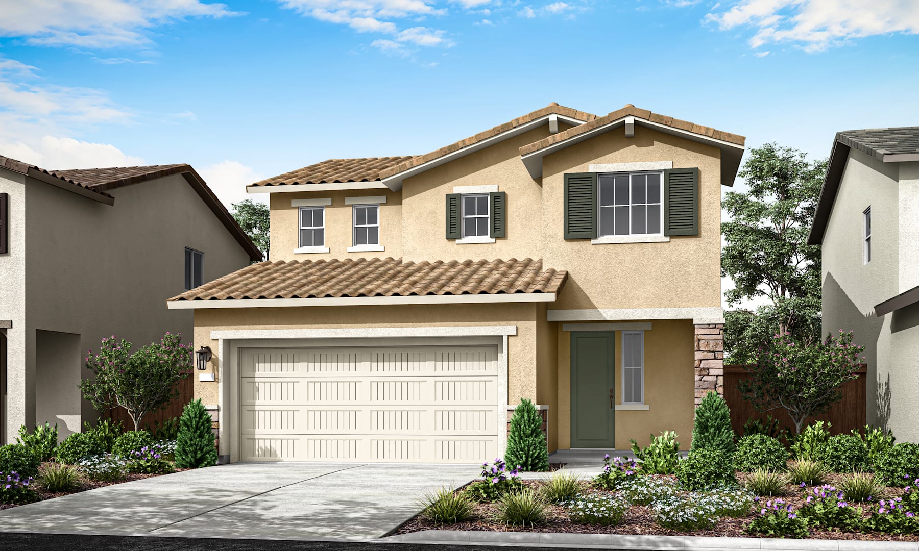 A two-story beige house with a tiled roof, a garage door, and a well-landscaped front yard with shrubs and flowers, set against a blue sky with scattered clouds.