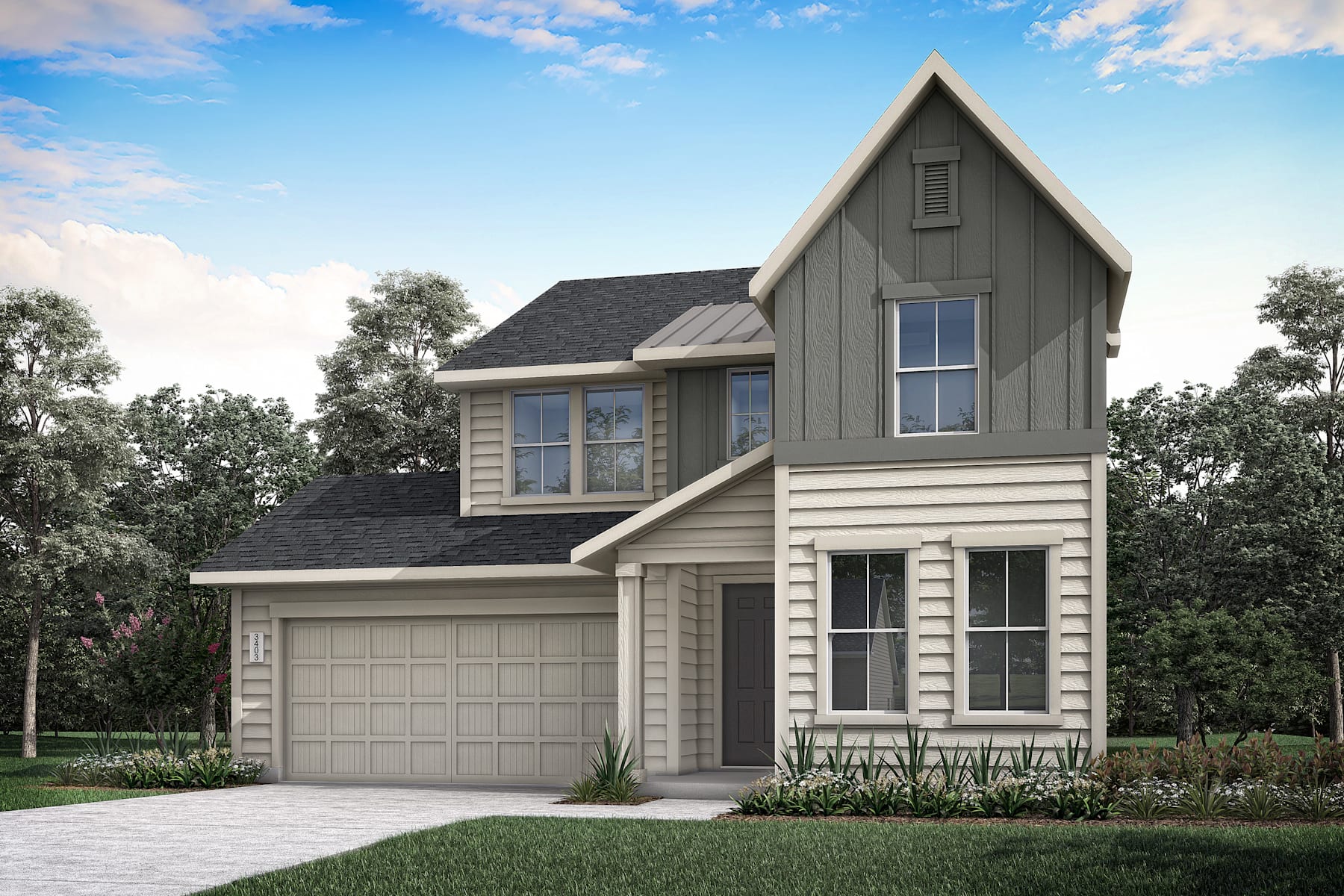 A two-story house with a gabled roof, gray siding, and a garage door stands in a landscaped yard surrounded by trees against a blue sky with scattered clouds.