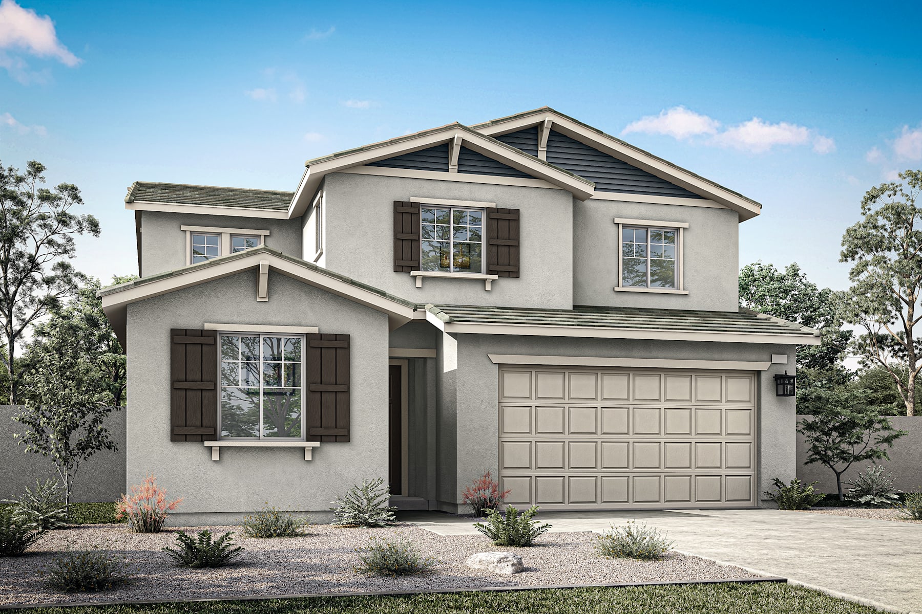 A two-story residential house with a garage, surrounded by trees and landscaping, set against a clear blue sky with some clouds.
