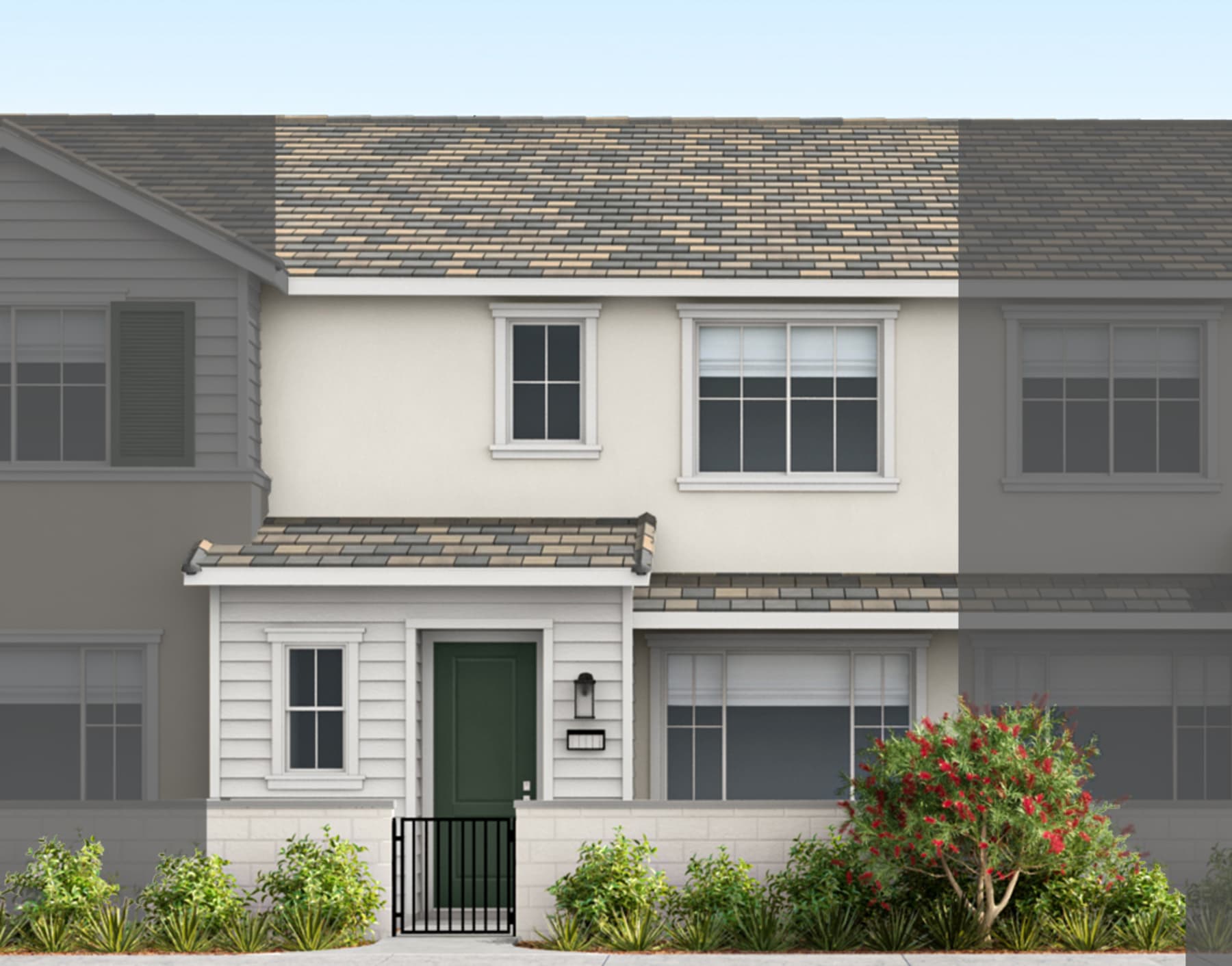 A two-story residential building with a green front door, surrounded by lush greenery and a paved walkway leading to the entrance.