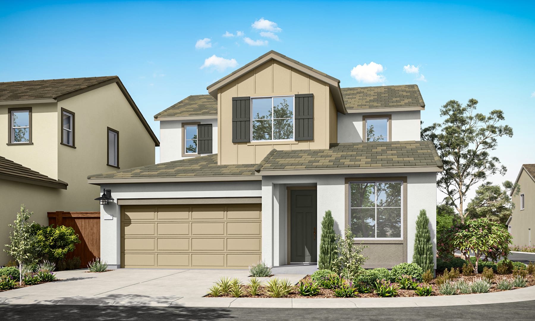 A two-story residential house with a garage, surrounded by landscaped gardens and trees against a clear blue sky.