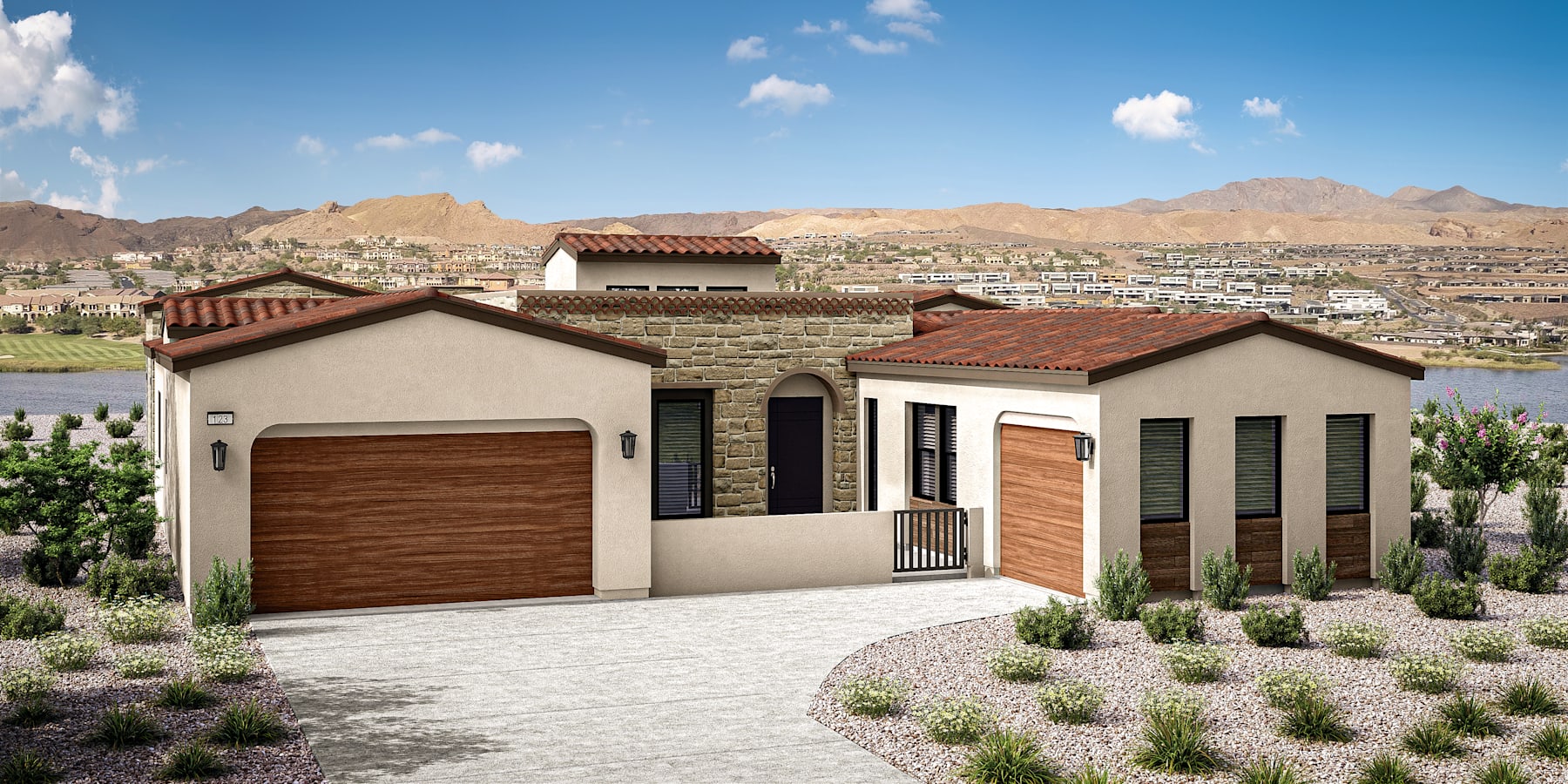 A residential house with a red tile roof, surrounded by a landscaped yard with plants and shrubs, set against a backdrop of a mountainous desert landscape.