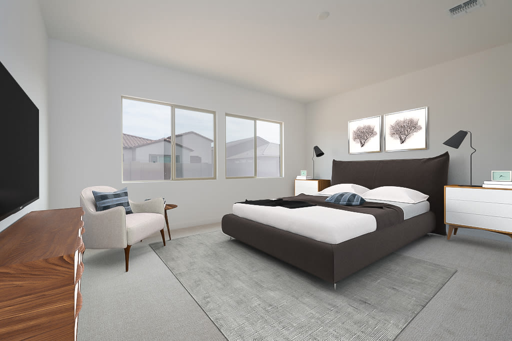 A modern and minimalist bedroom with a large bed, white walls, and large windows overlooking the exterior of the house.
