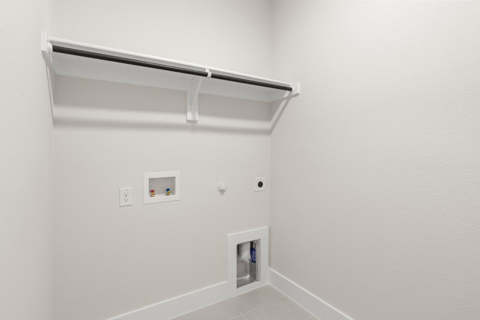 A white wall with a recessed light fixture and an electrical outlet visible in the foreground.