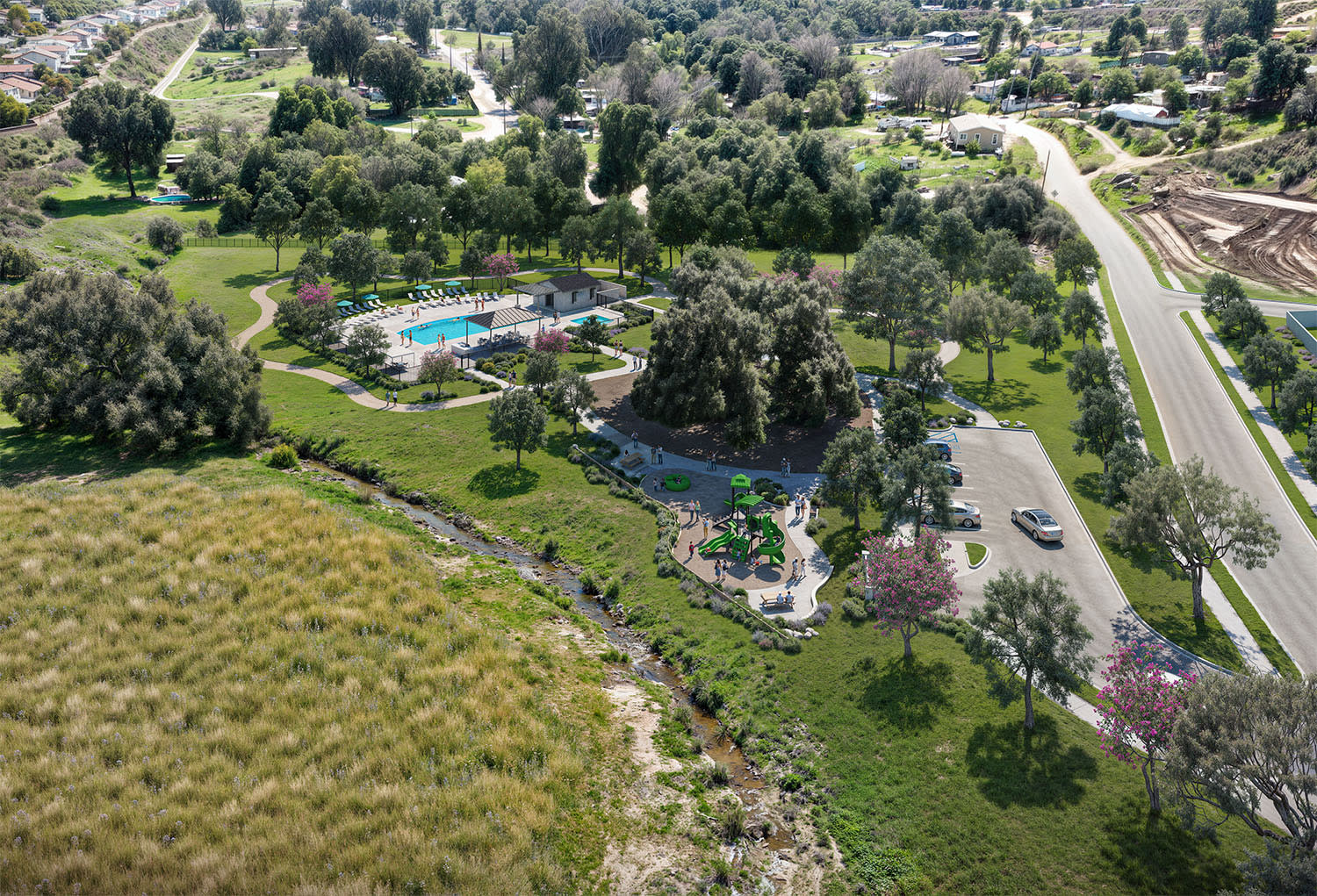 A lush, verdant landscape with a swimming pool and other recreational facilities nestled among the trees, surrounded by rolling hills and a winding road in the background.