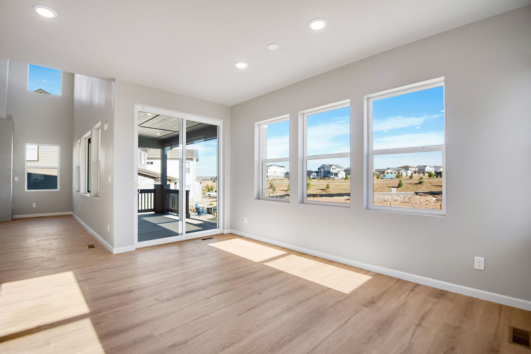 A bright and spacious interior with large windows overlooking a scenic outdoor landscape.