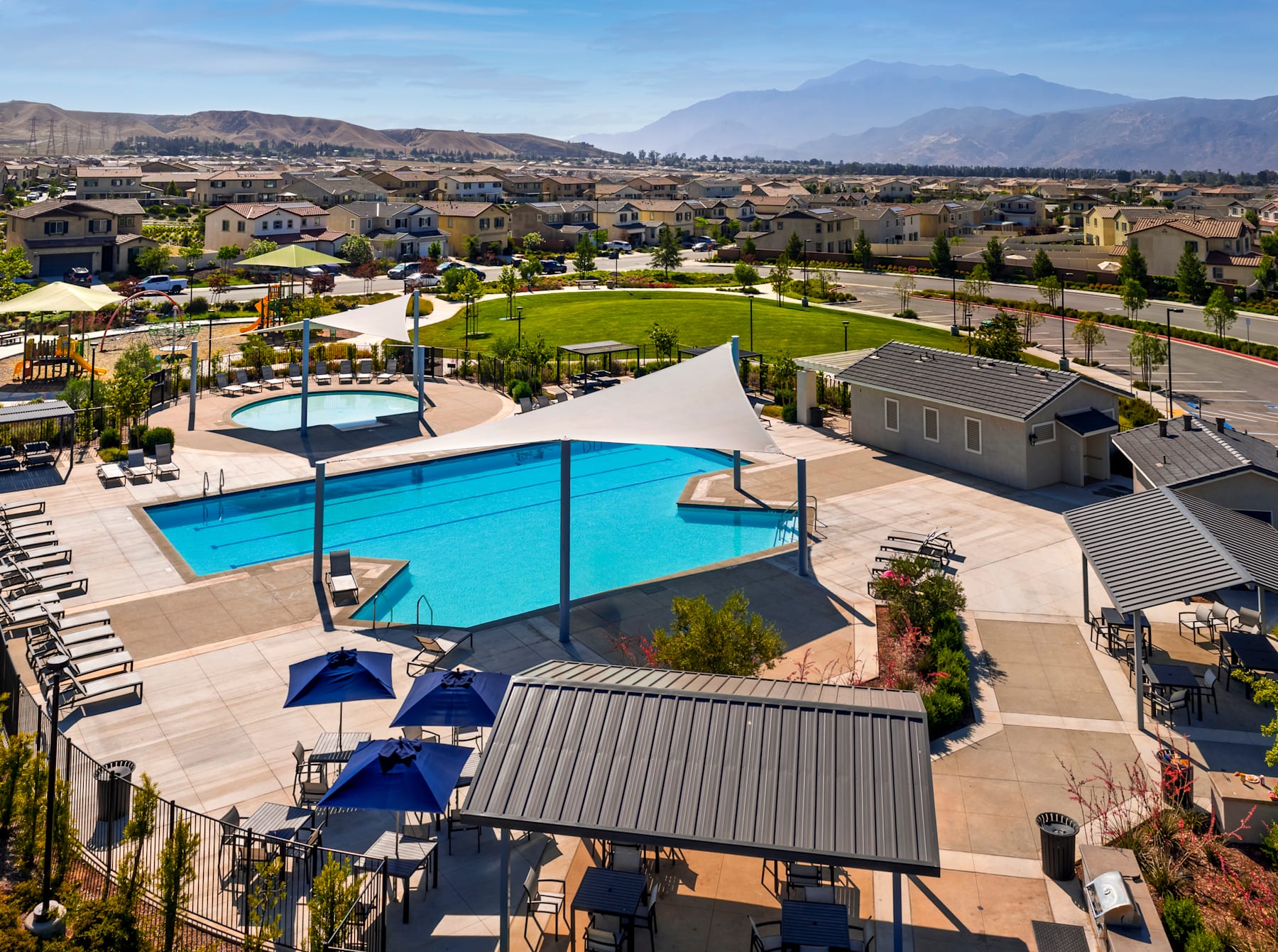 Sparkling pools, playgrounds, and welcoming spaces come together to create a true sense of community.