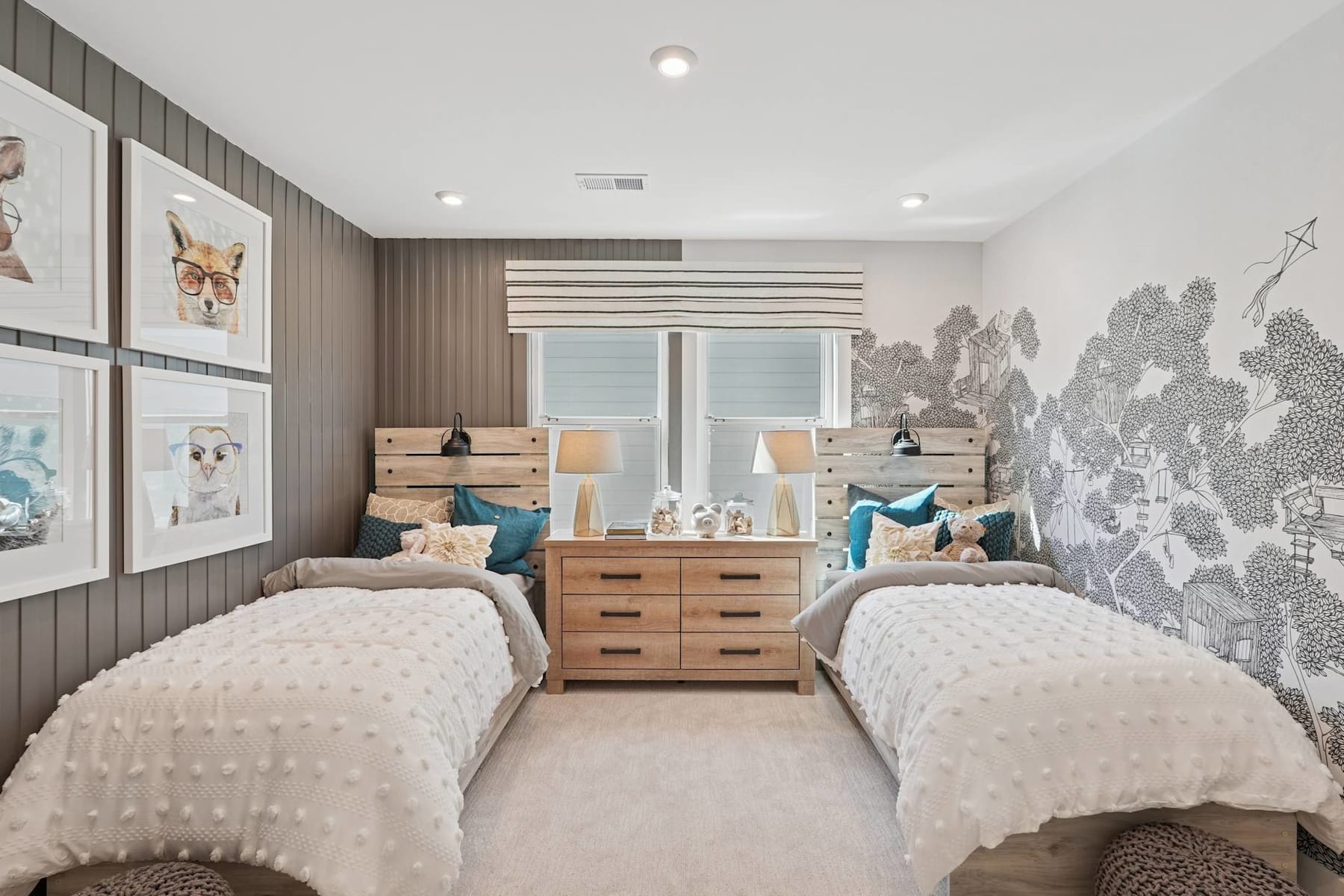 A cozy and stylish bedroom with two twin beds, wooden furniture, and decorative wall art, creating a warm and inviting atmosphere.
