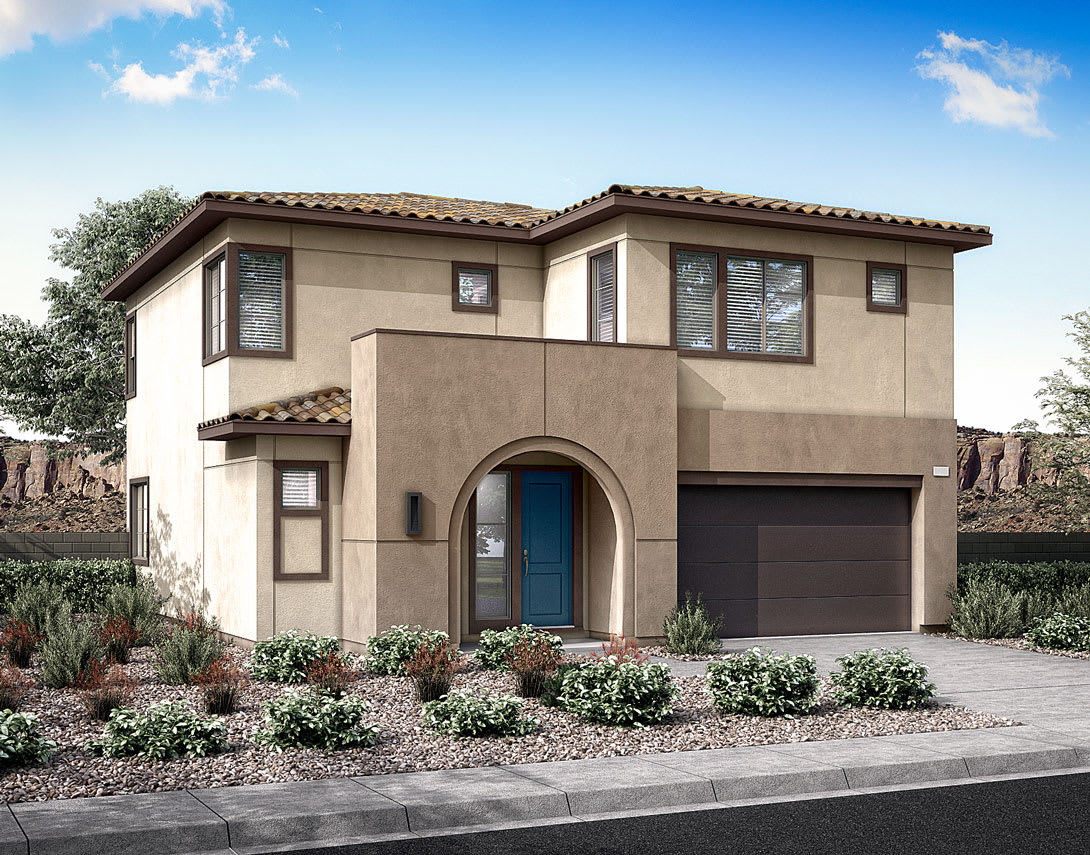 A two-story Mediterranean-style house with a tiled roof, a garage door, and a landscaped front yard with plants and shrubs.