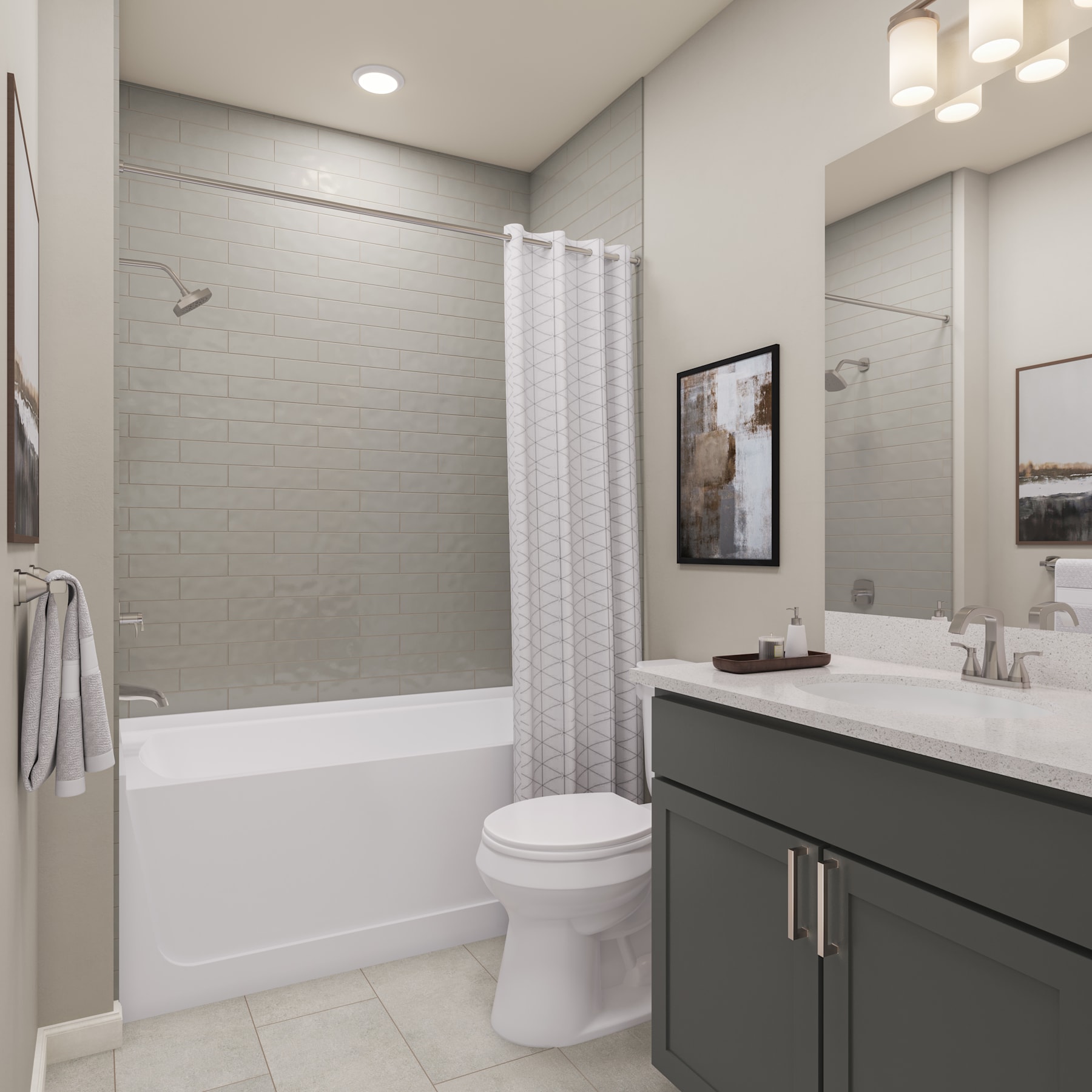 A modern and minimalist bathroom with a white bathtub, a gray vanity cabinet, and a framed artwork on the wall.
