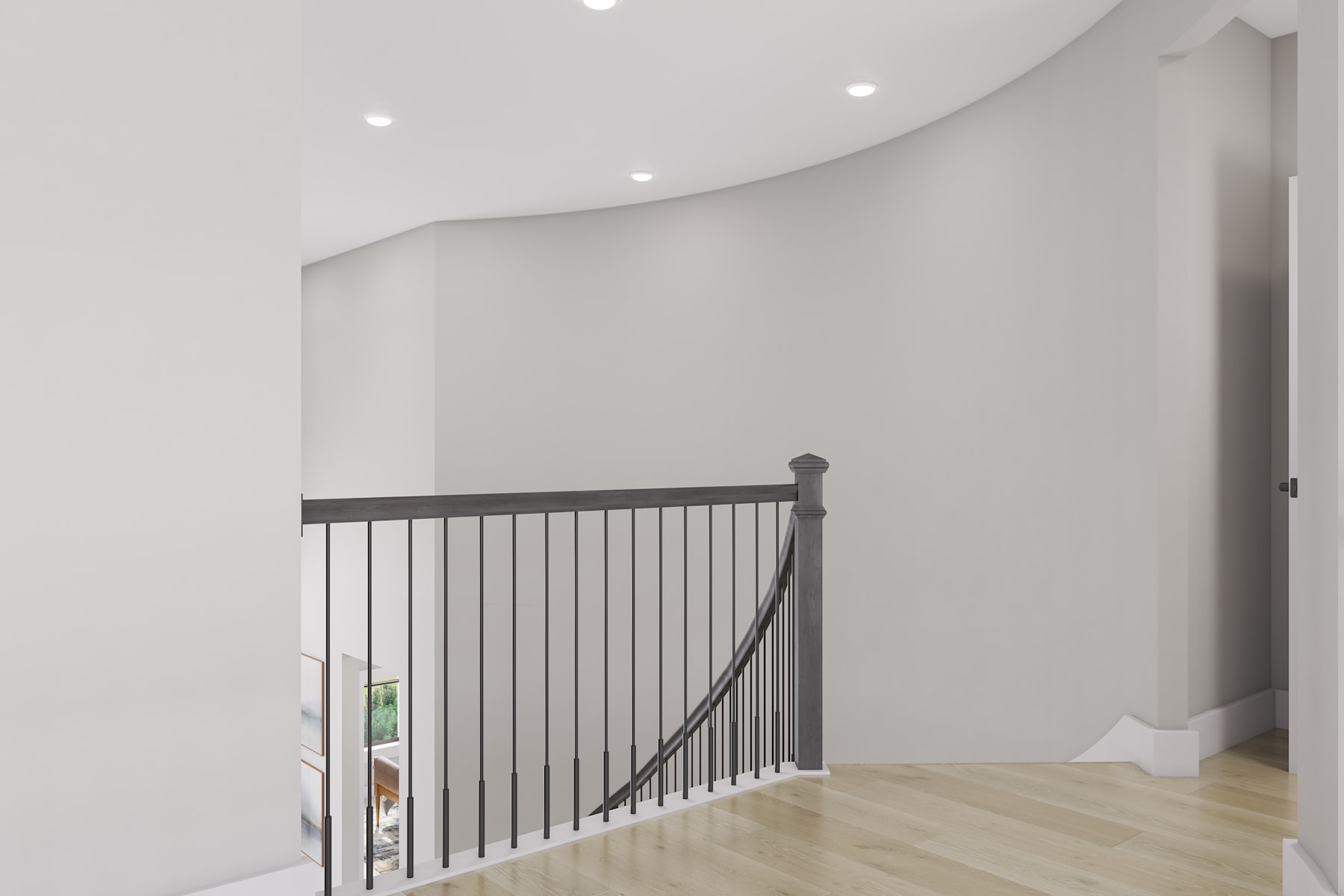 A spacious, minimalist hallway with a curved wall and a metal railing leading up the stairs, featuring a light-colored wooden floor.