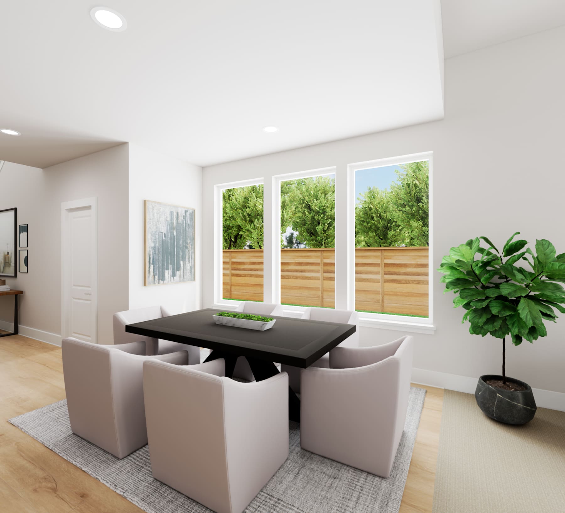 A modern and minimalist dining area with a black rectangular table surrounded by gray upholstered chairs, set against a backdrop of large windows overlooking a lush, green outdoor space.