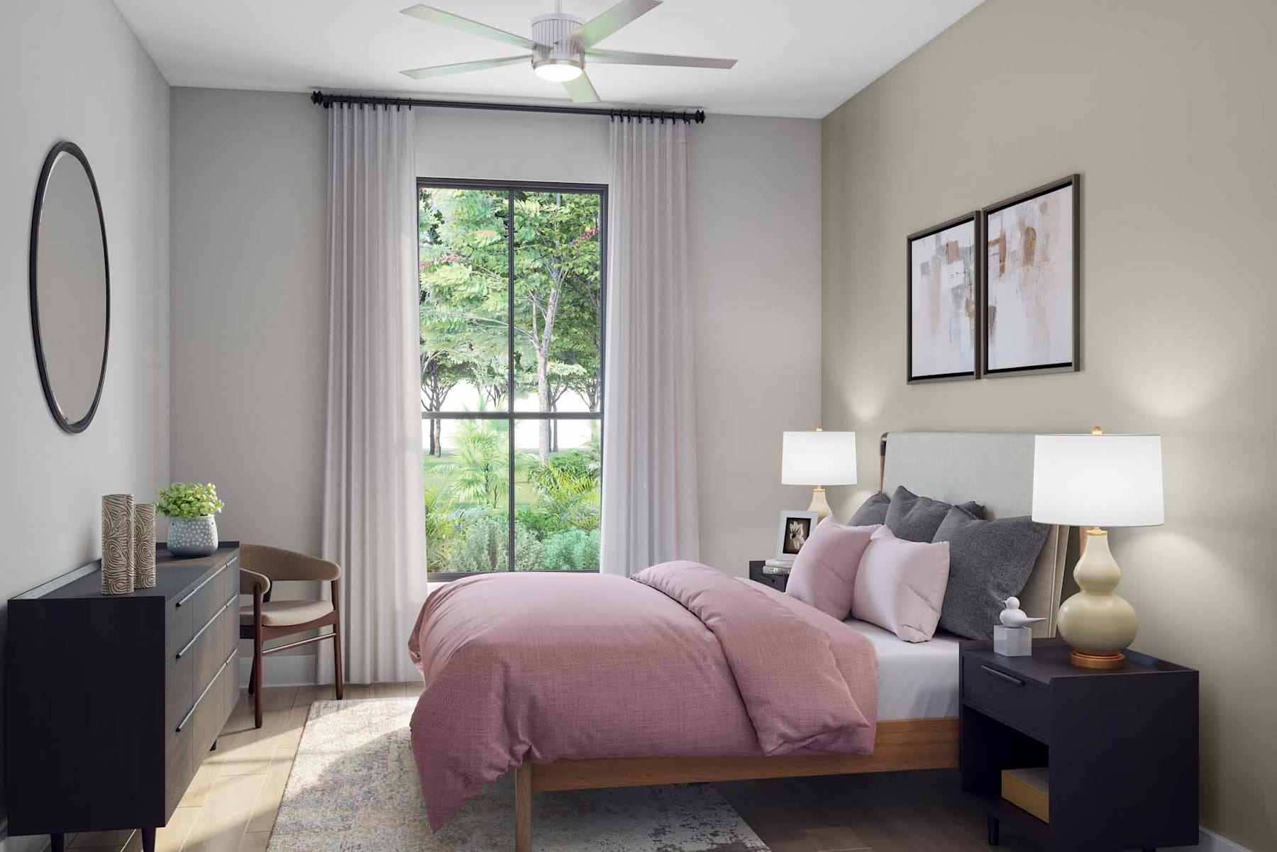 A cozy and inviting bedroom with a large window overlooking lush greenery, featuring a plush pink bedding set, dark wood furniture, and a ceiling fan.