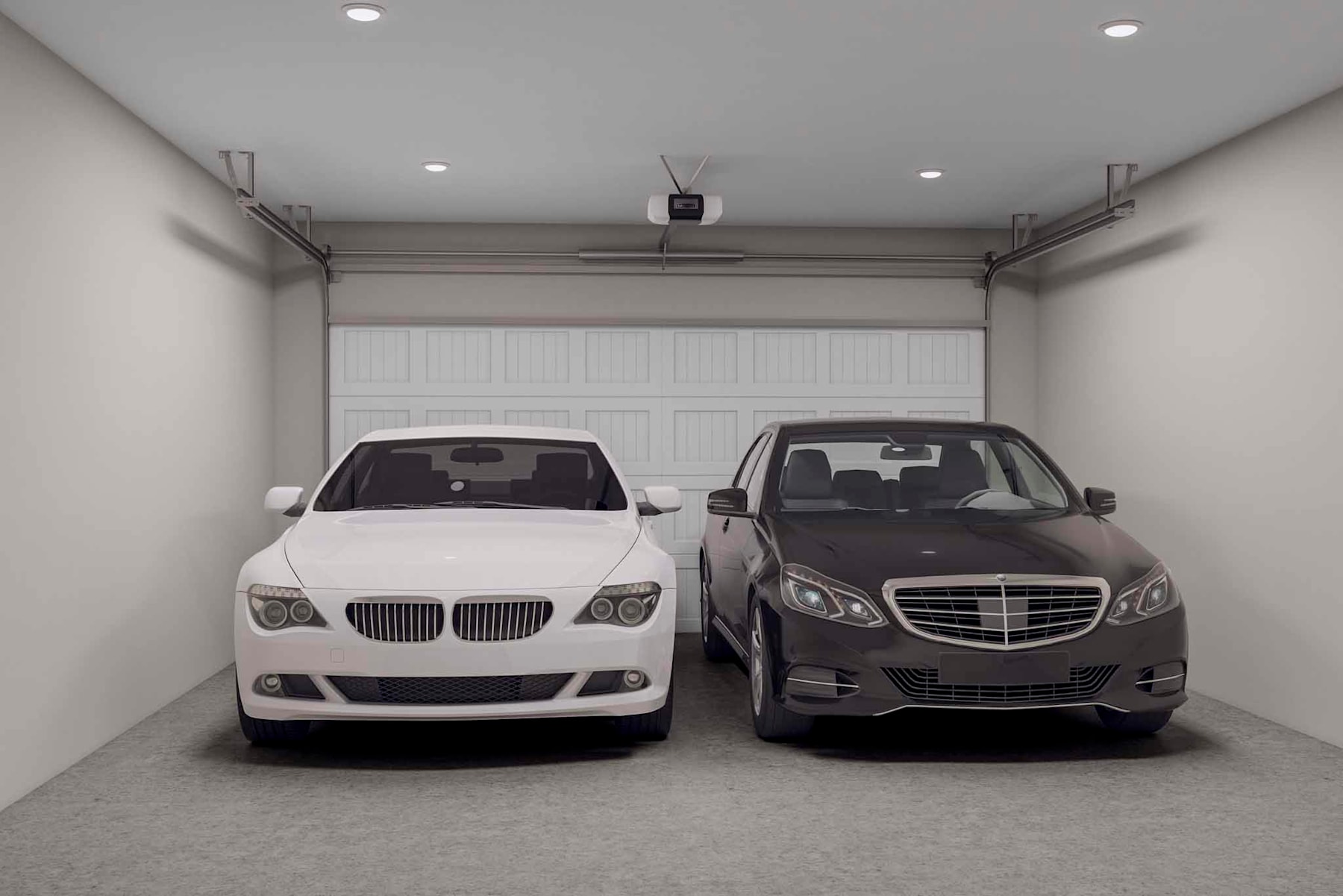 A garage interior with two luxury vehicles, a white BMW and a dark Mercedes-Benz, parked side by side.