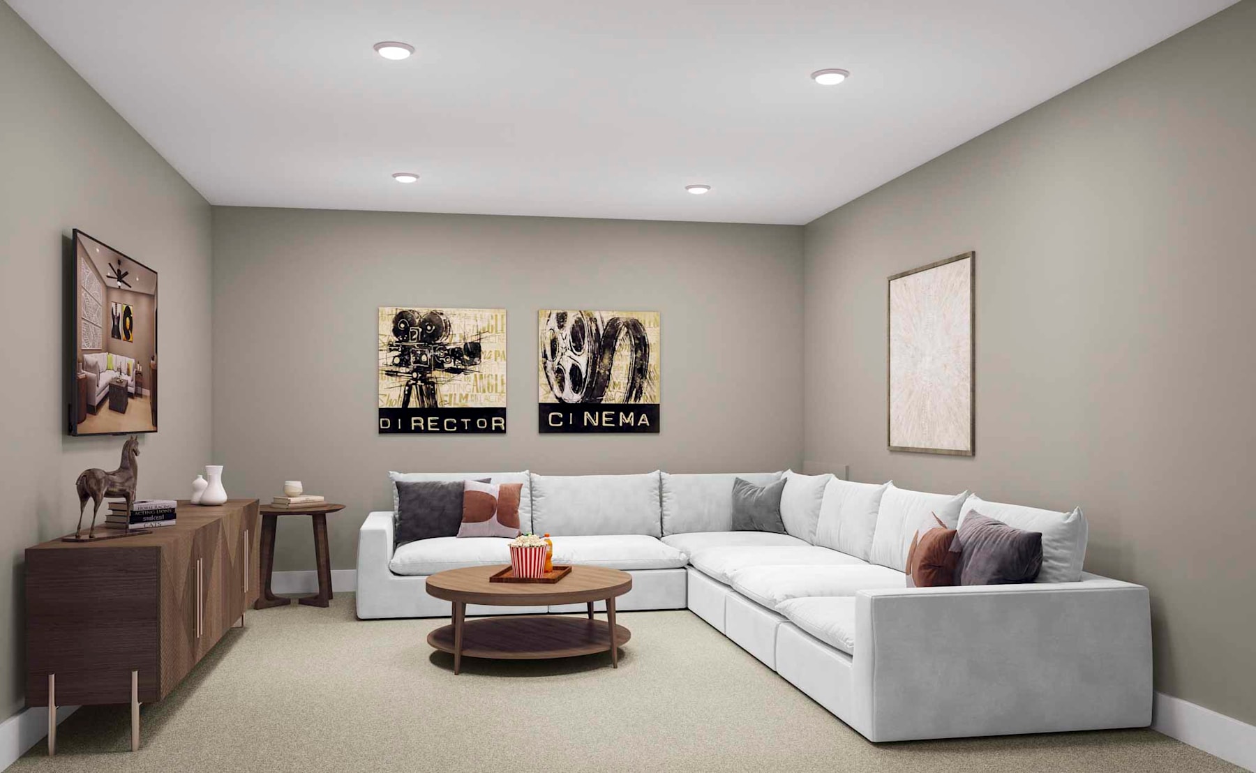 A cozy living room with a white sectional sofa, wooden side tables, and framed movie posters on the walls, creating a warm and inviting atmosphere.