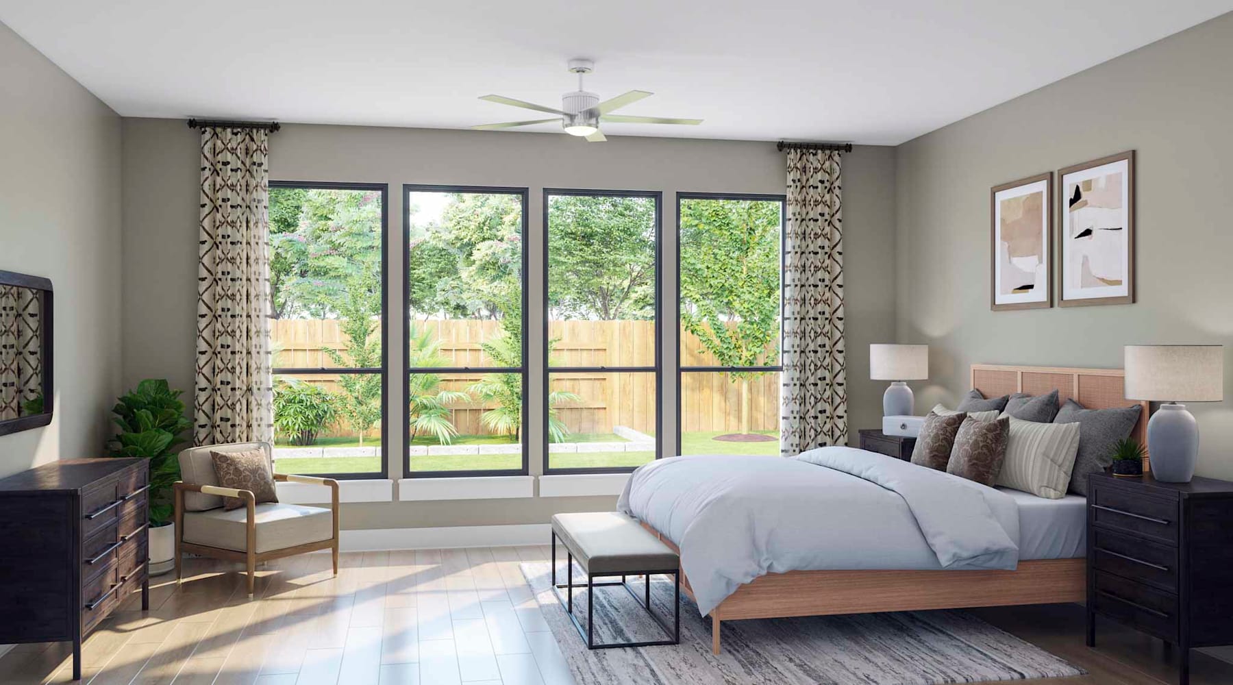 A cozy and well-furnished bedroom with large windows overlooking a lush, green outdoor space.