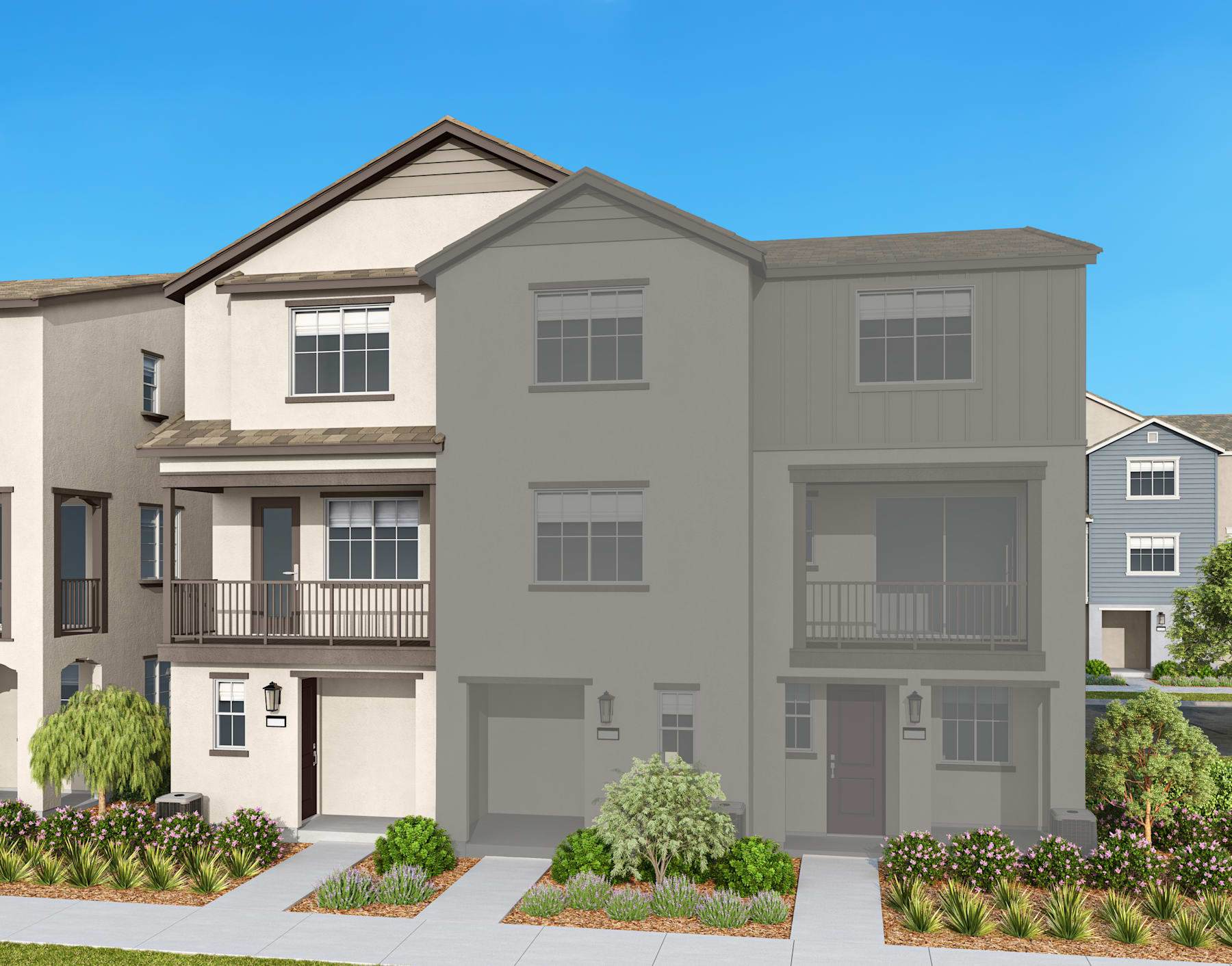 A multi-story residential building with a gray exterior, surrounded by landscaped greenery and a clear blue sky in the background.