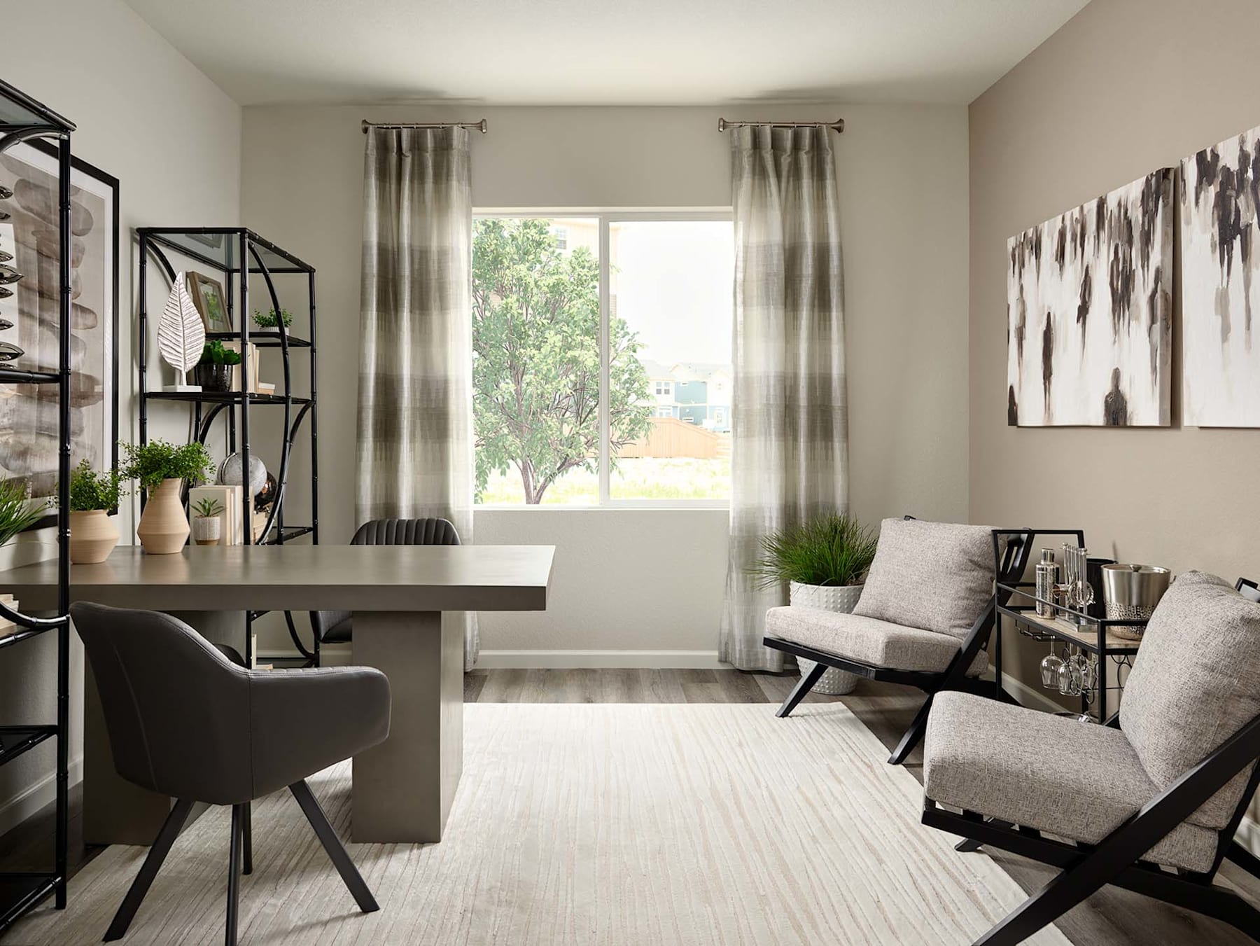 A modern and minimalist home office space with a wooden desk, comfortable chair, and shelving unit, set against a backdrop of large windows overlooking a natural outdoor scene.