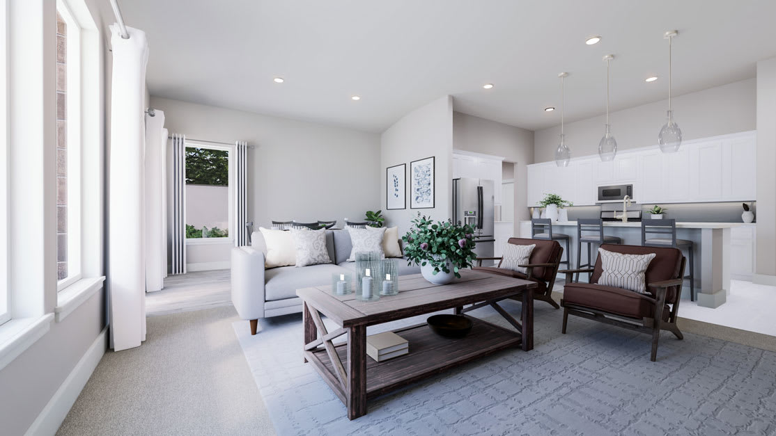 A modern and minimalist living room with a wooden coffee table, white sofa, and a kitchen area visible in the background.