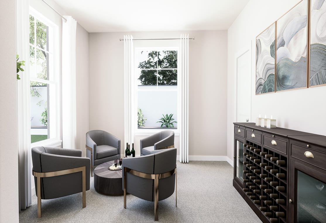 A cozy and modern living room with comfortable gray armchairs, a wine rack, and artwork on the walls, surrounded by large windows that provide a view of the outdoors.