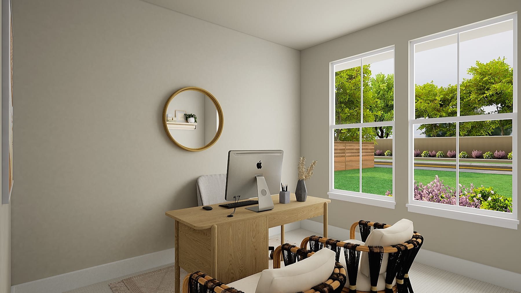 A cozy and well-lit room with a wooden console table, a round mirror, and a view of a lush, green outdoor space through the large windows.