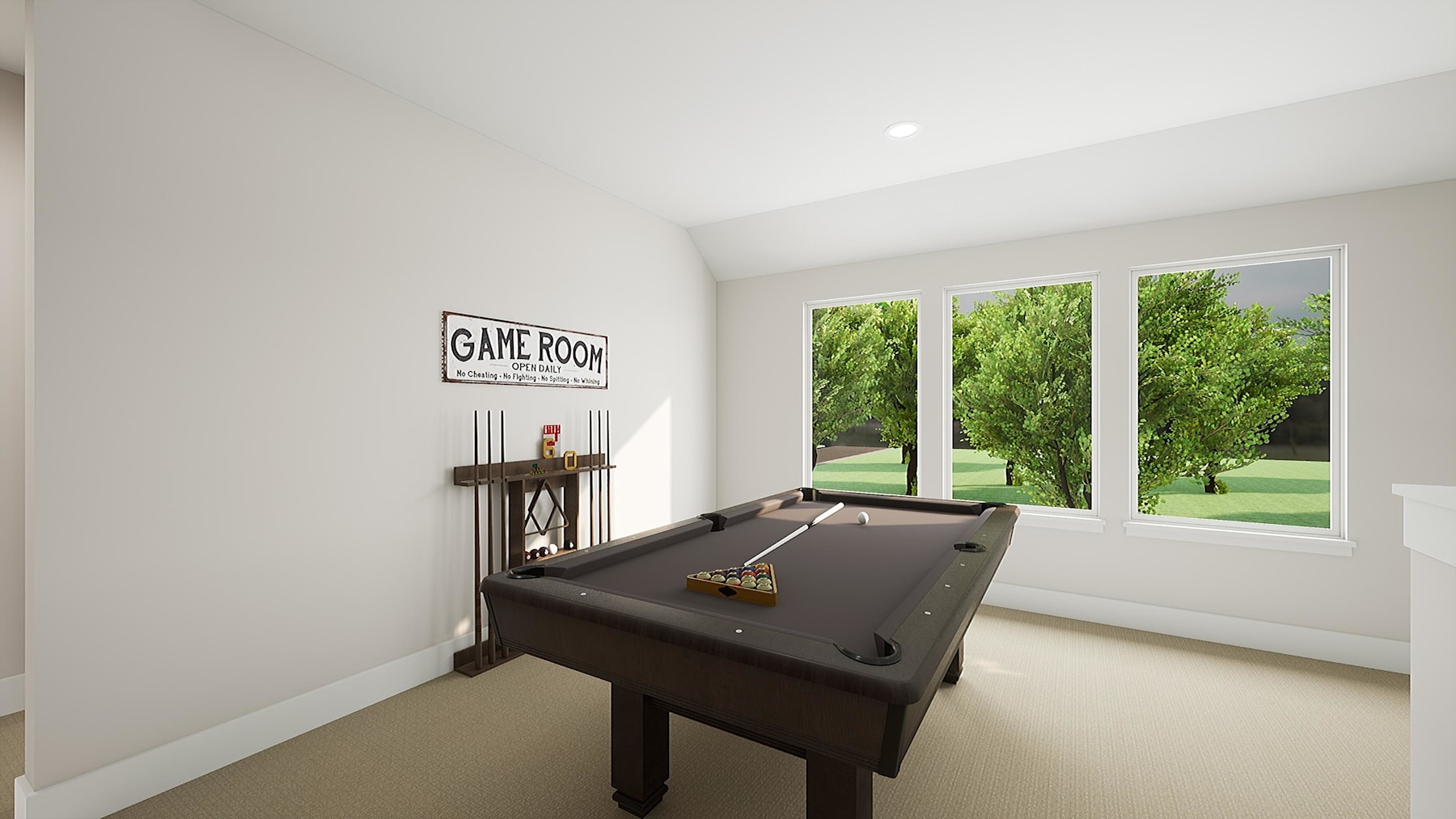A modern game room with a pool table and a large window overlooking a lush, green outdoor landscape.