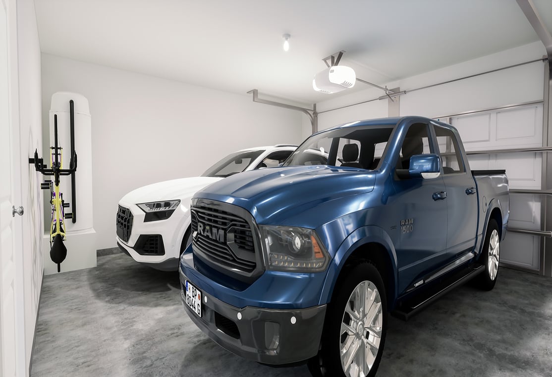 The image shows a large, blue pickup truck parked in a garage, with another smaller white vehicle visible in the background.