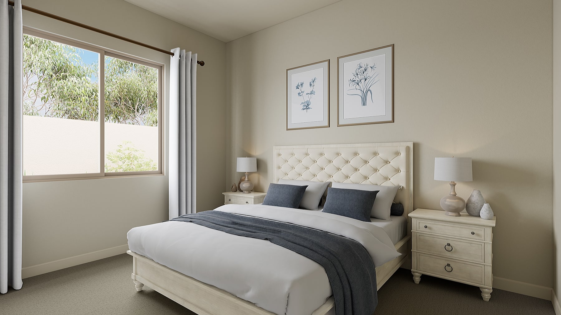 A cozy and well-appointed bedroom with a tufted white headboard, neutral-toned bedding, and framed artwork on the walls, set against a backdrop of a large window overlooking a lush outdoor landscape.