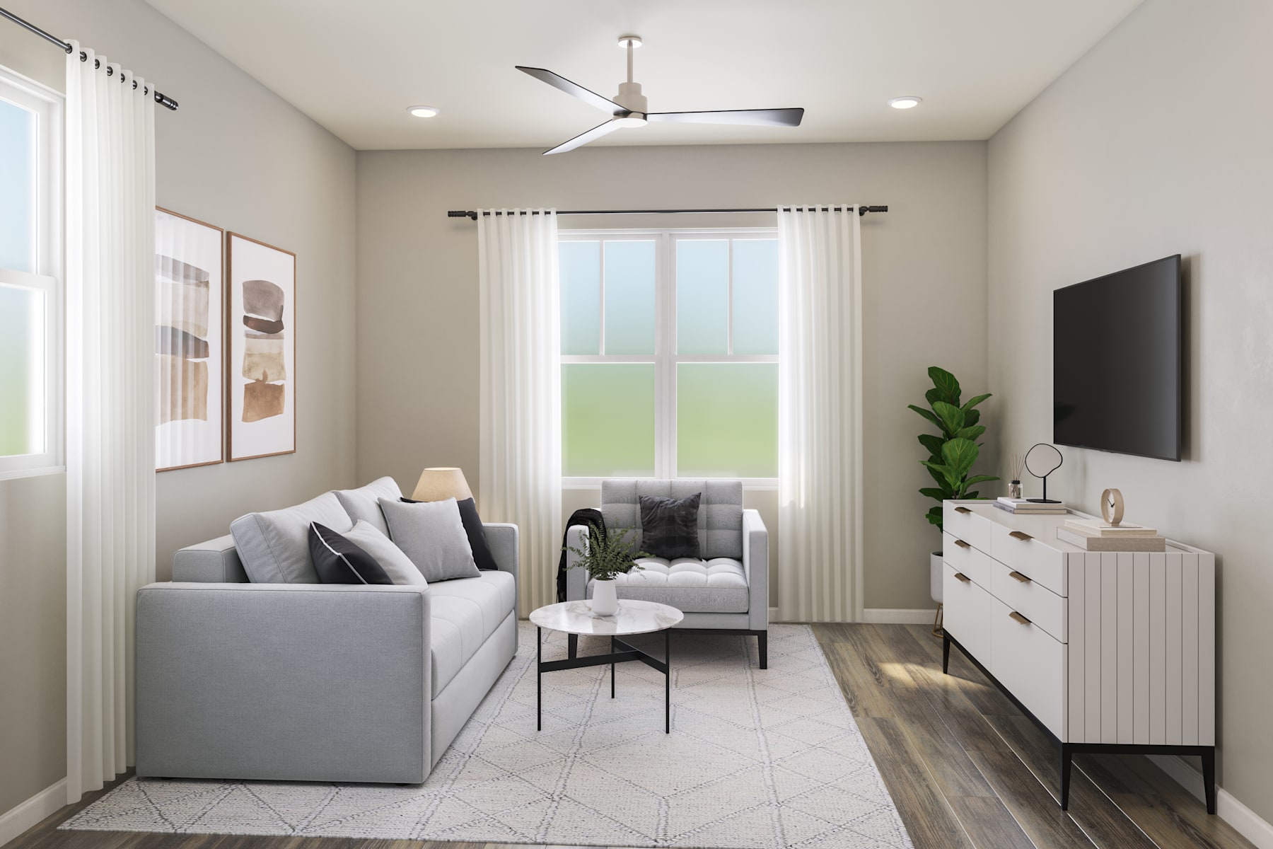 A cozy living room with a gray sofa, a white dresser, and a ceiling fan, set against a backdrop of a large window overlooking a grassy outdoor area.