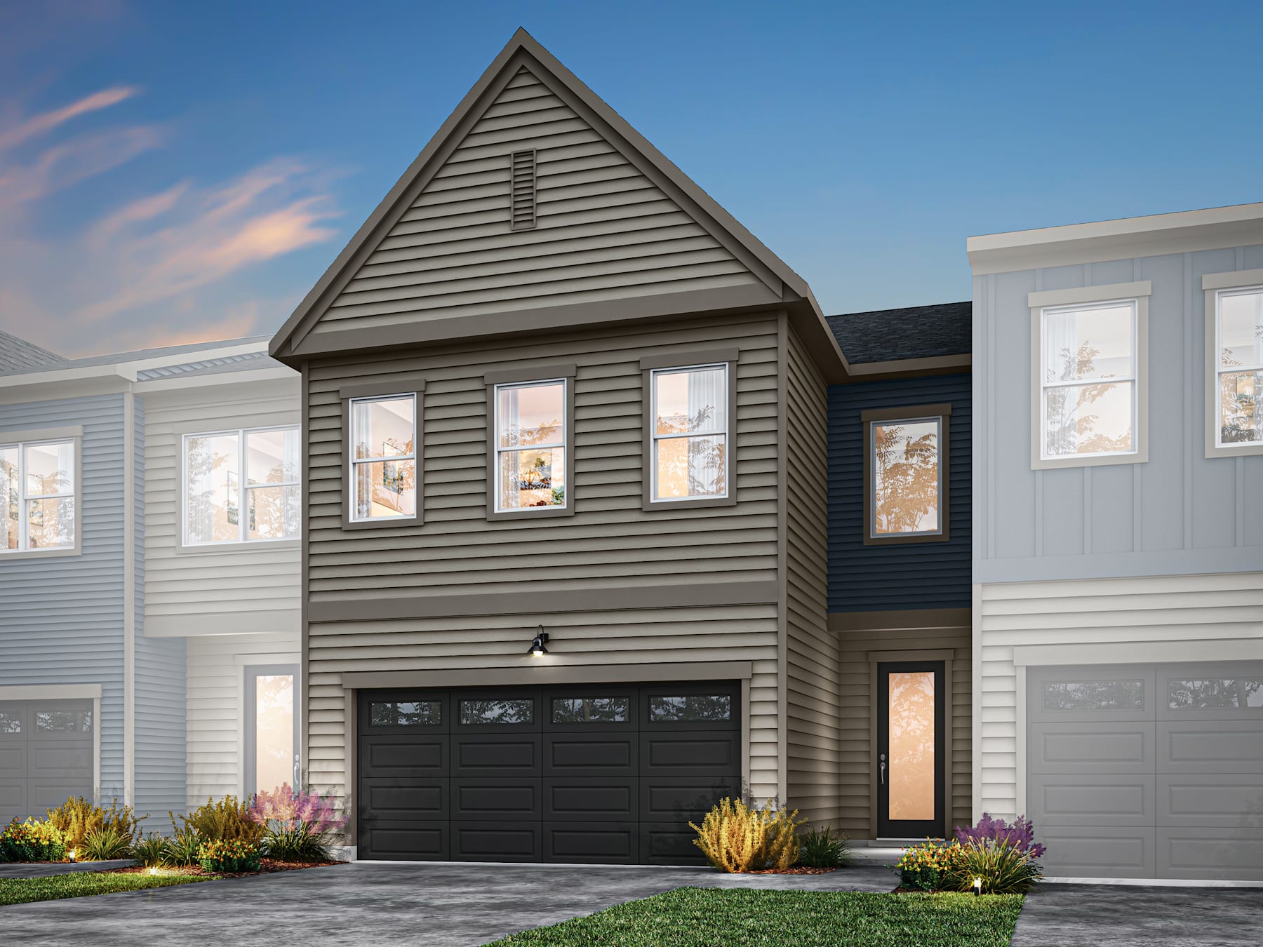 A modern two-story house with a triangular gable roof, gray siding, and a black garage door, set against a clear blue sky with wispy clouds.