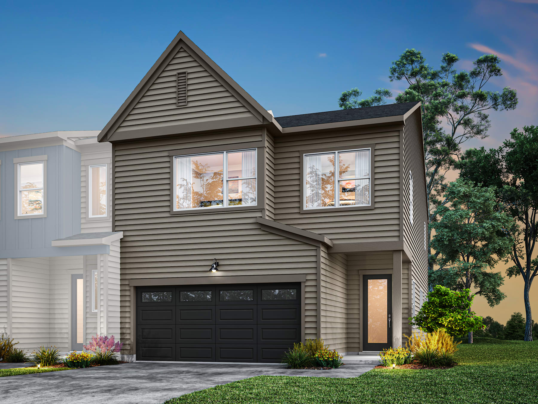 A two-story residential house with a gabled roof, gray siding, and a black garage door, set against a backdrop of lush greenery and a clear blue sky.