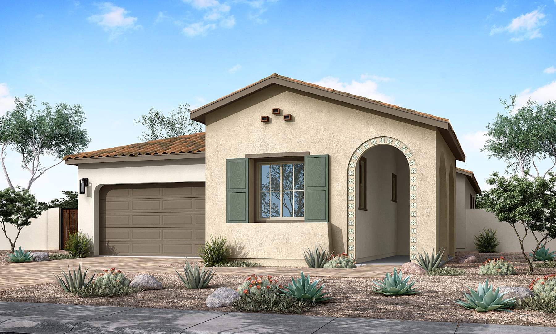 A single-story stucco house with a tiled roof, surrounded by desert landscaping and a paved driveway leading to a garage door.