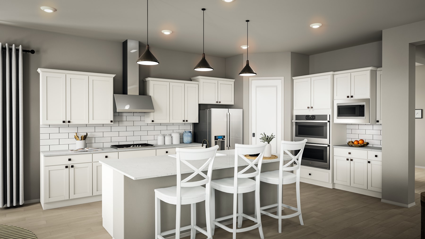 A modern, well-lit kitchen with white cabinets, a white countertop, and pendant lights hanging above a central island with bar stools.
