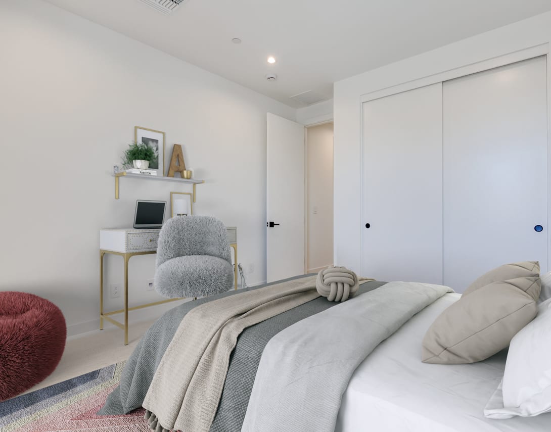 A cozy and minimalist bedroom with a plush gray bedding, a white dresser, and a decorative shelf with potted plants and artwork.