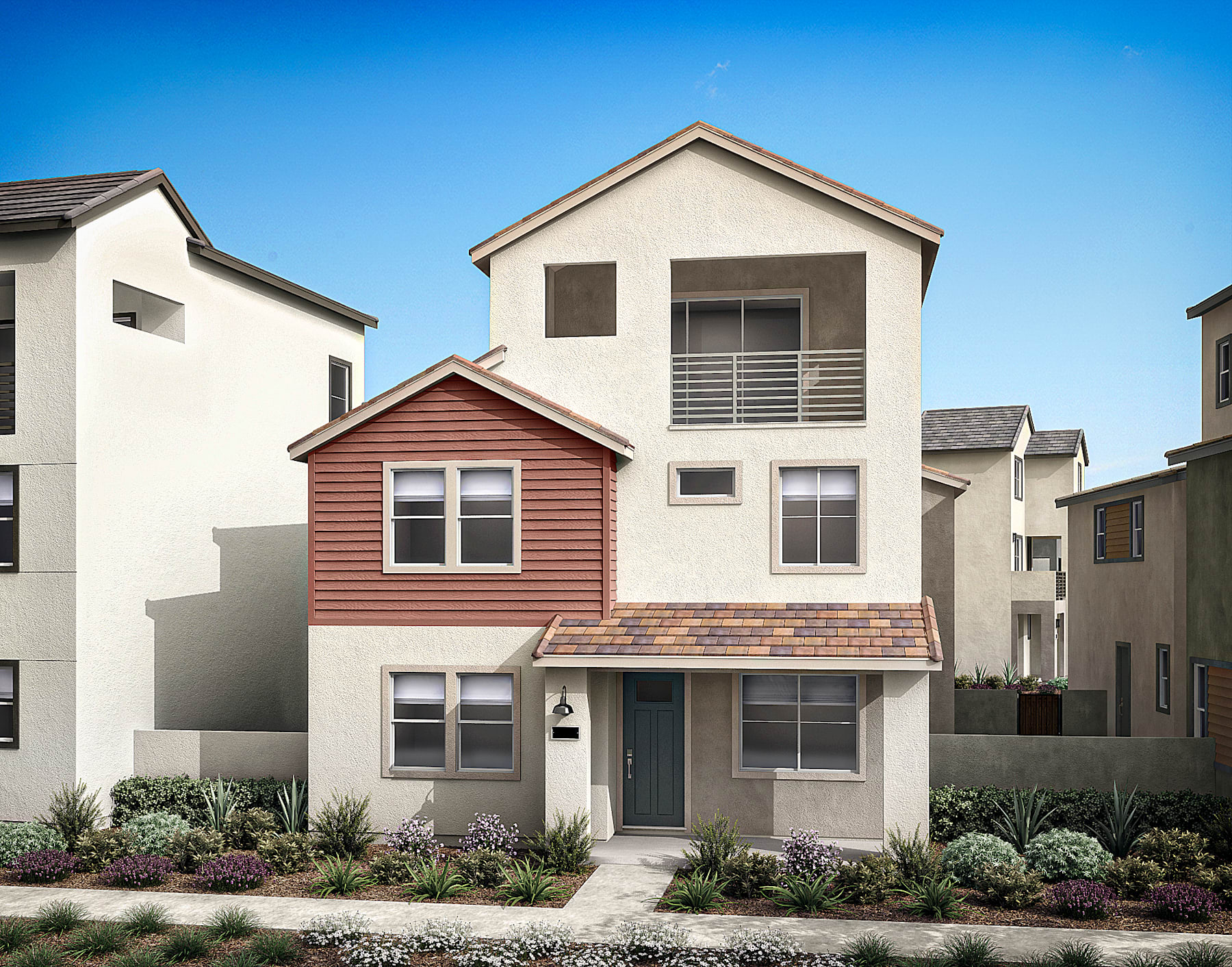 The image depicts a residential neighborhood with several multi-story houses, each with a distinct architectural style and color scheme. The foreground features a red-colored house with a balcony and a well-maintained landscaped yard, set against a clear blue sky.