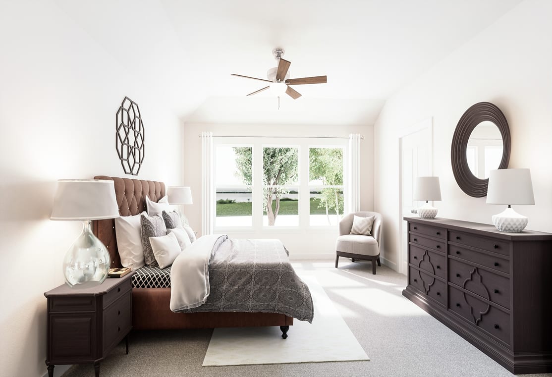 A cozy and well-decorated bedroom with a large window overlooking a lush outdoor scene, featuring a bed, dresser, and various decorative elements.