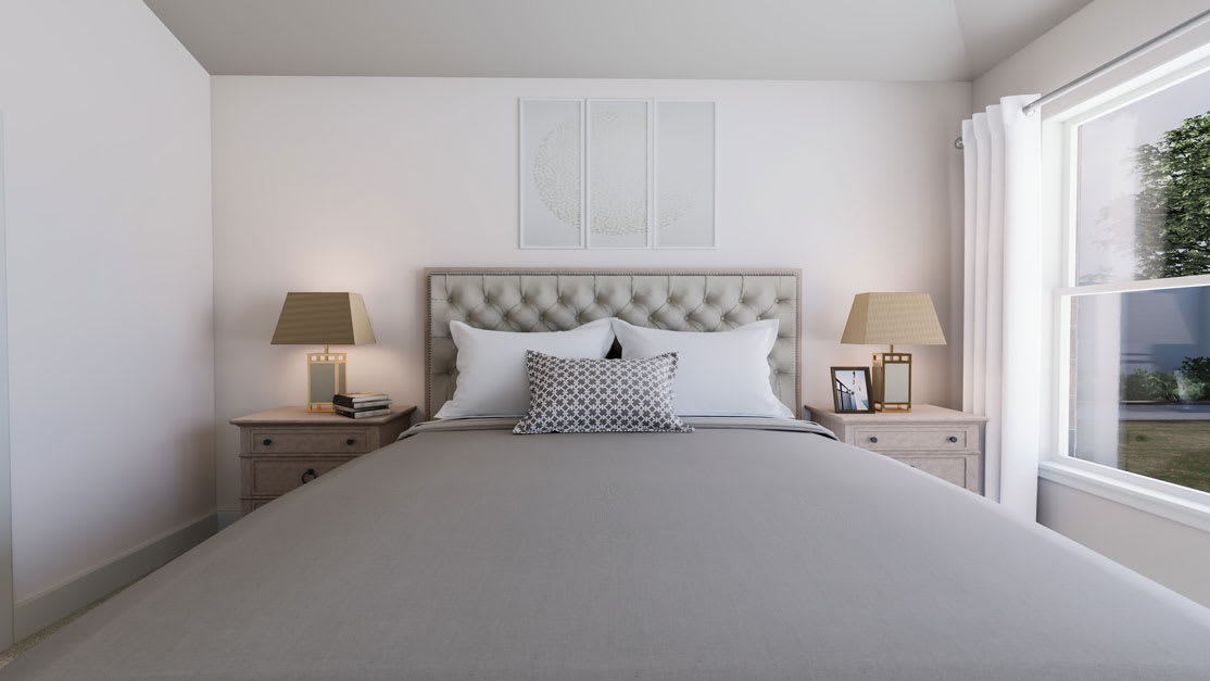 A cozy and well-designed bedroom with a tufted headboard, nightstands, and a large window providing natural light.