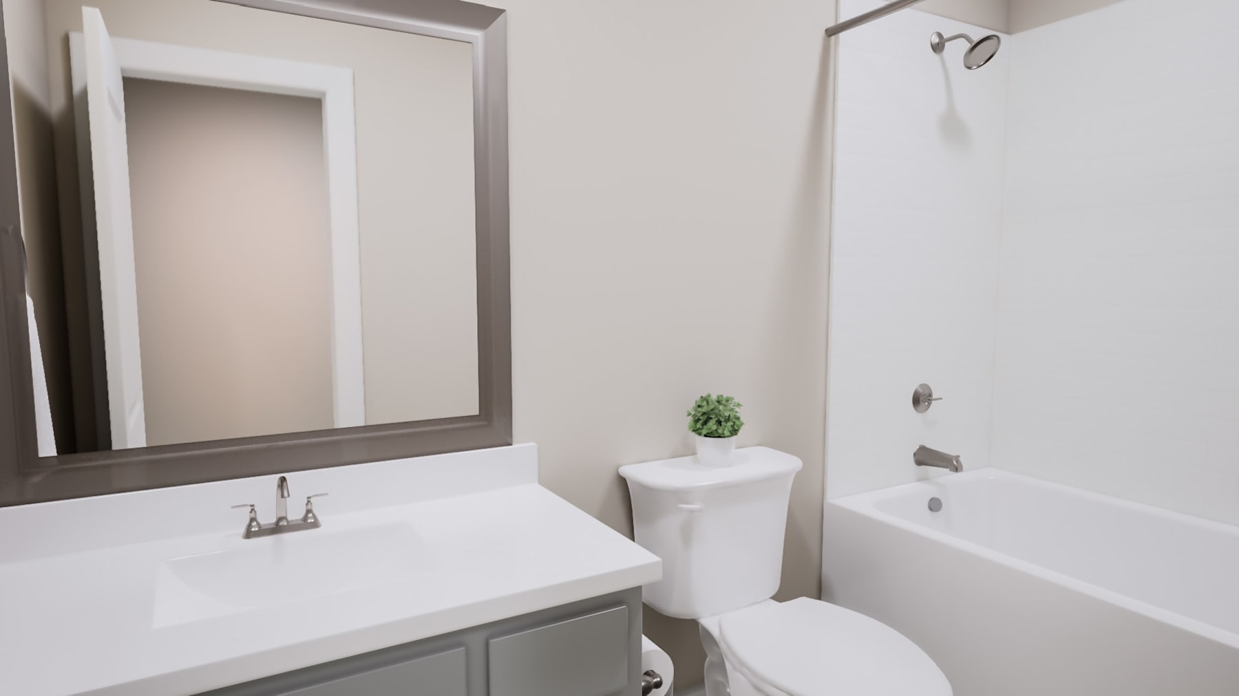 A modern bathroom with a white sink, toilet, and bathtub, along with a framed mirror on the wall.