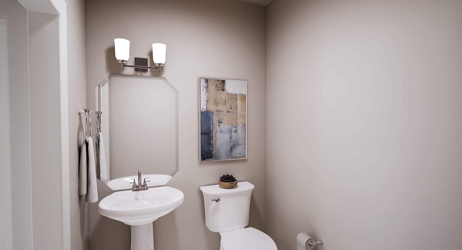 A small, minimalist bathroom with a white toilet, a pedestal sink, and a framed artwork on the wall, illuminated by a pair of wall sconces.